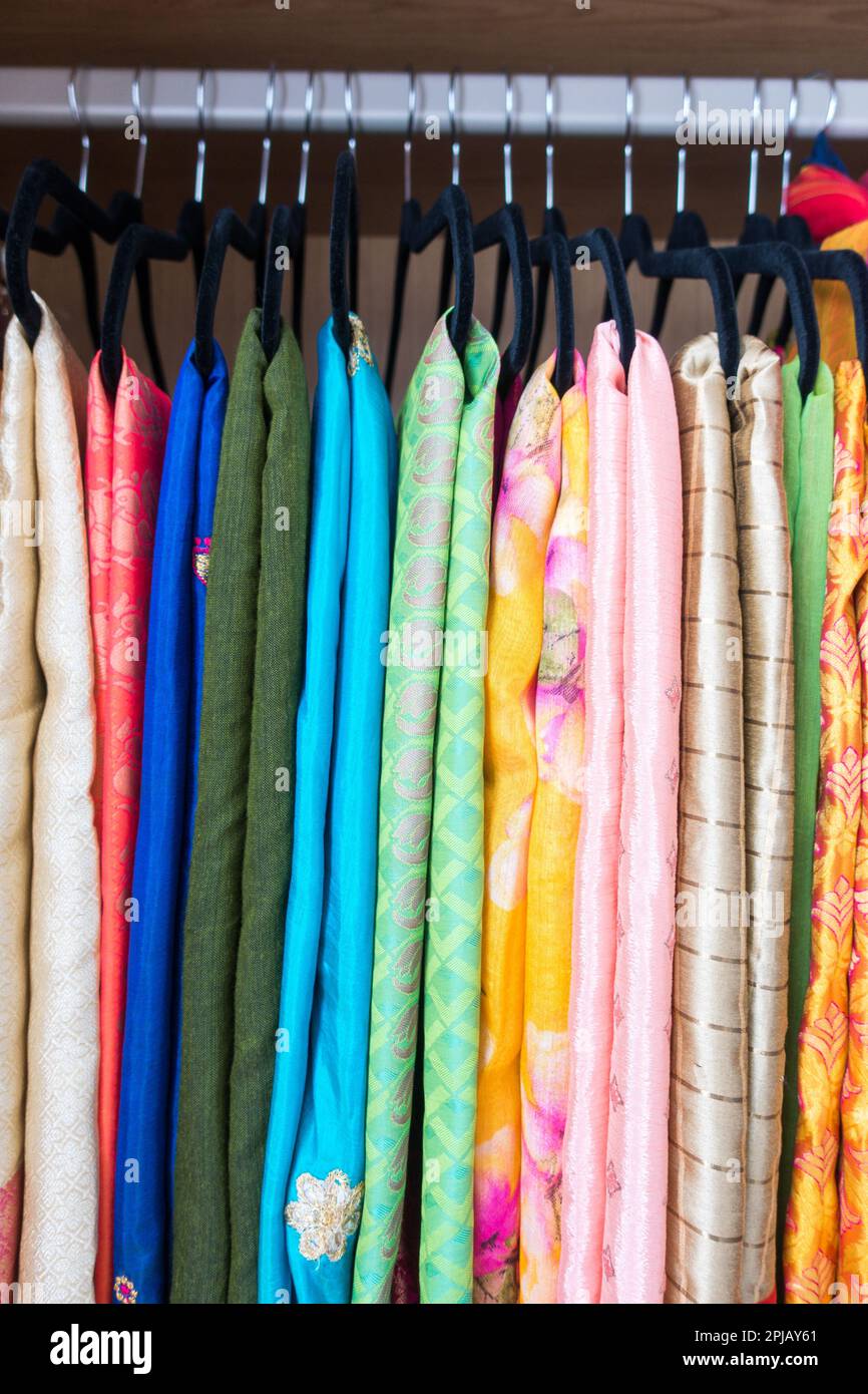 Colorful vibrant Indian Sarees in wardrobe Stock Photo Alamy