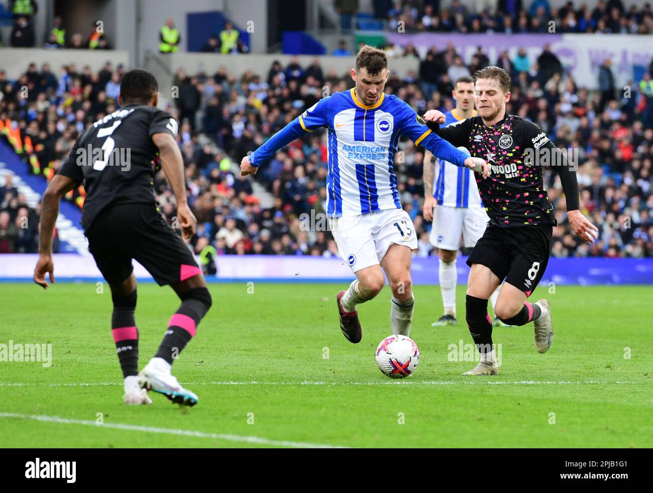 Brighton, UK. 01st Apr, 2023. Pascal Gross of Brighton and Hove Albion controls the ball under pressure from Mathias Jensen of Brentford during the Premier League match between Brighton & Hove Albion and Brentford at The Amex on April 1st 2023 in Brighton, England. (Photo by Jeff Mood/phcimages.com) Credit: PHC Images/Alamy Live News Stock Photo