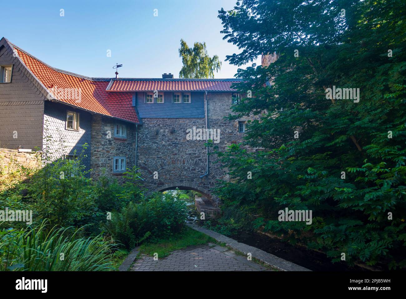 Goslar: city wall with opening Oberes Wasserloch (Upper water hole), view from the Pfalzgarten in Harz, Niedersachsen, Lower Saxony, Germany Stock Photo