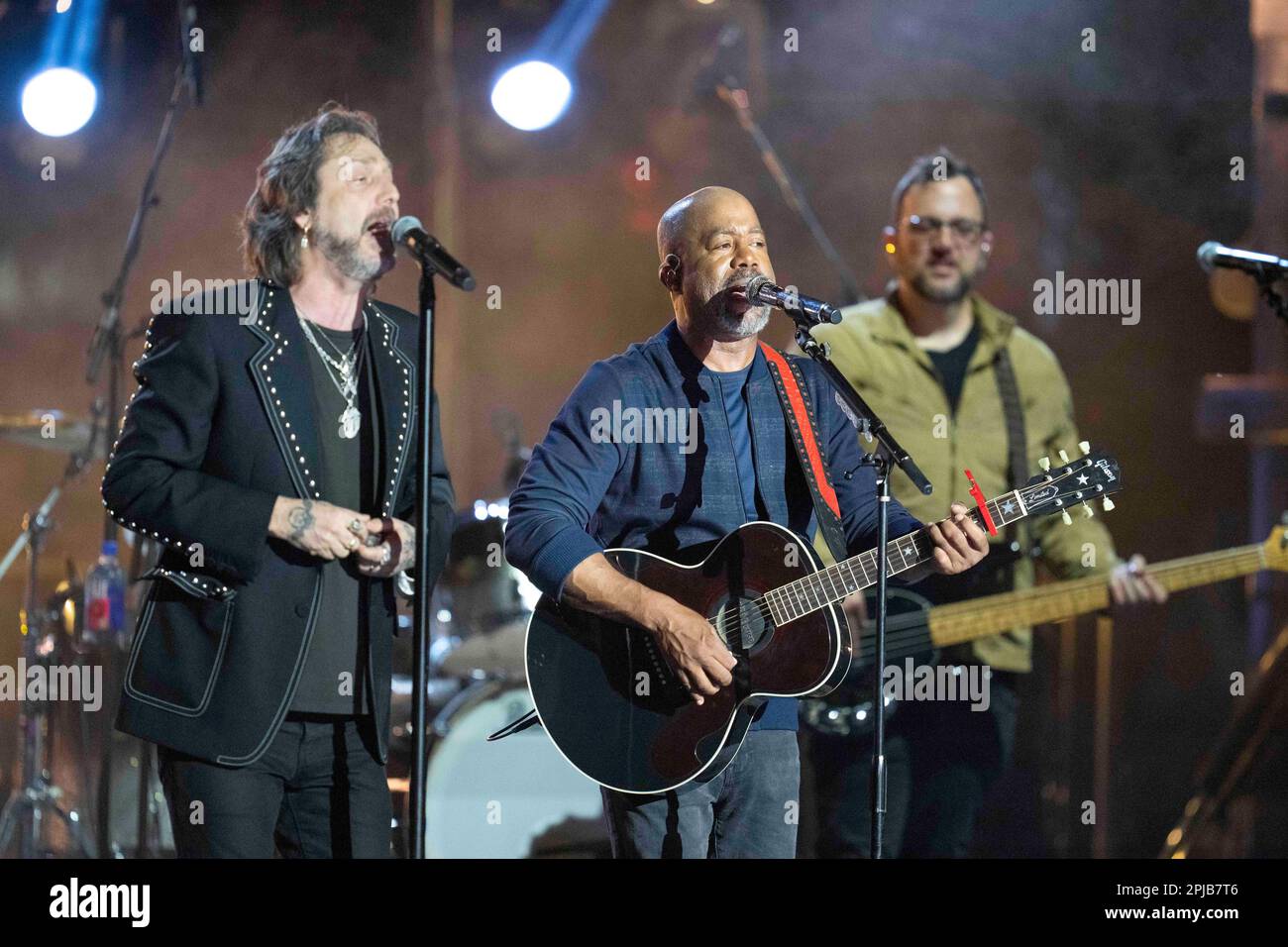 Austin Texas USA, March 31 2023: Chris Robinson of the Black Crowes and country star Darius Rucker perform together during a taping of Country Music Television's long-running Crossroads show at an outdoor stage in downtown. The show brings together a country artist with artists from another musical genre. ©Bob Daemmrich Stock Photo