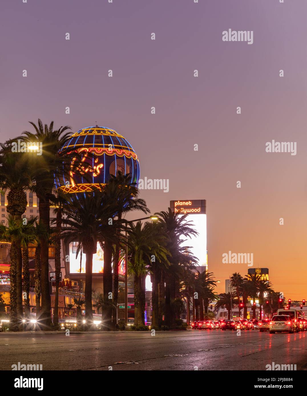 A picture of the Paris Las Vegas Balloon Sign and the Planet Hollywood Las Vegas Resort and Casino billboard at sunset. Stock Photo