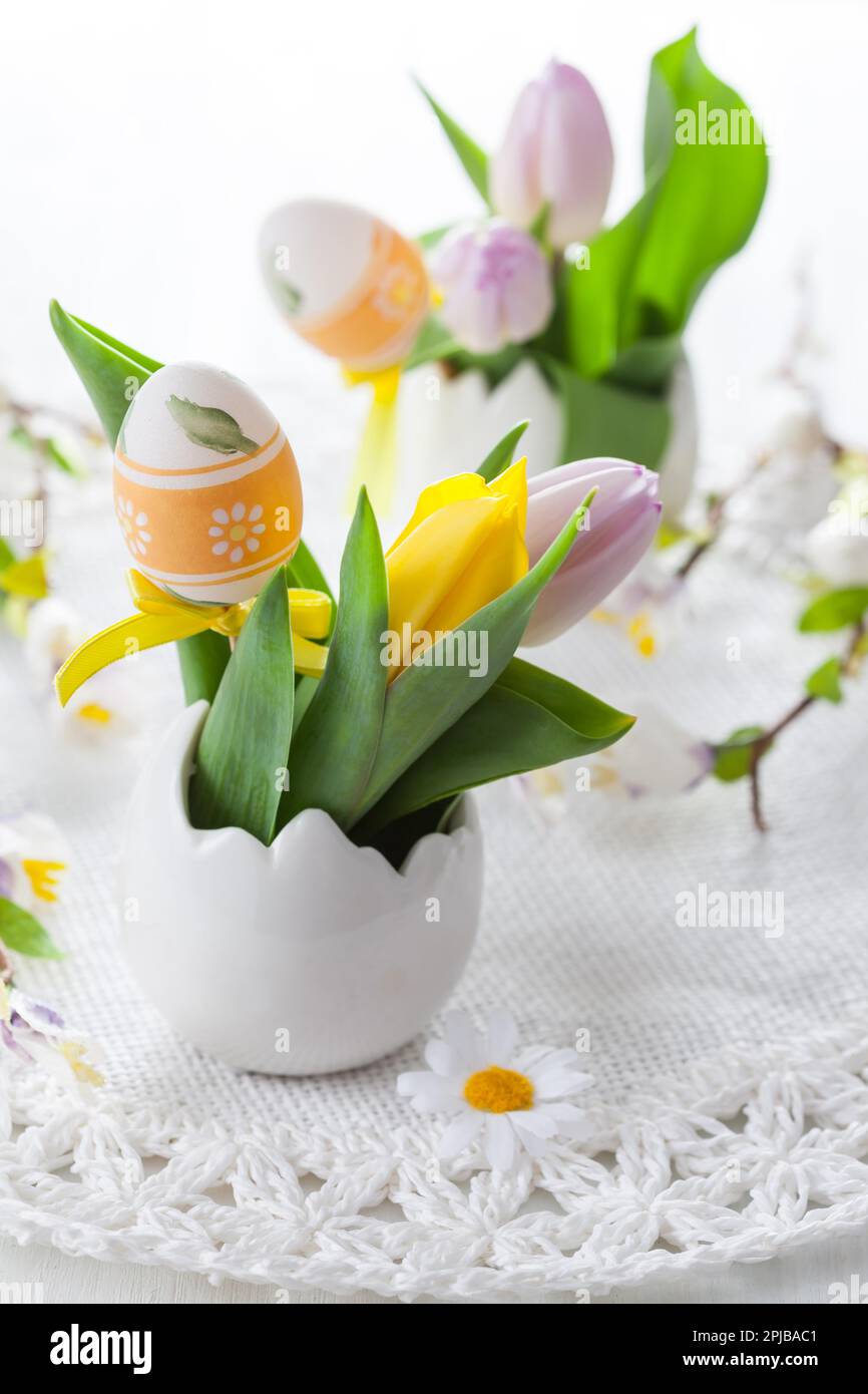 Easter table setting with painted eggs Stock Photo