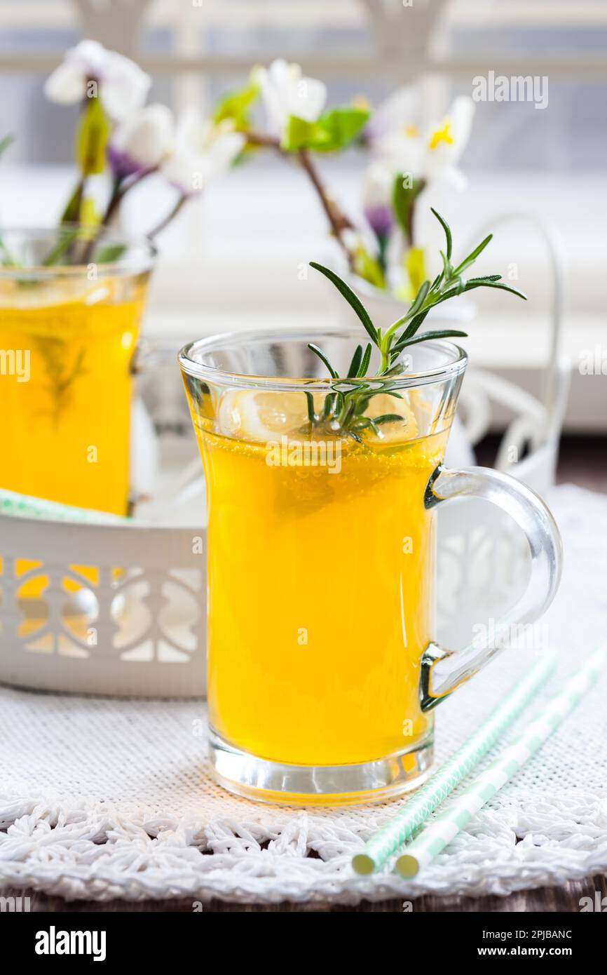 Fresh lemon drink with rosemary in glass cup Stock Photo Alamy