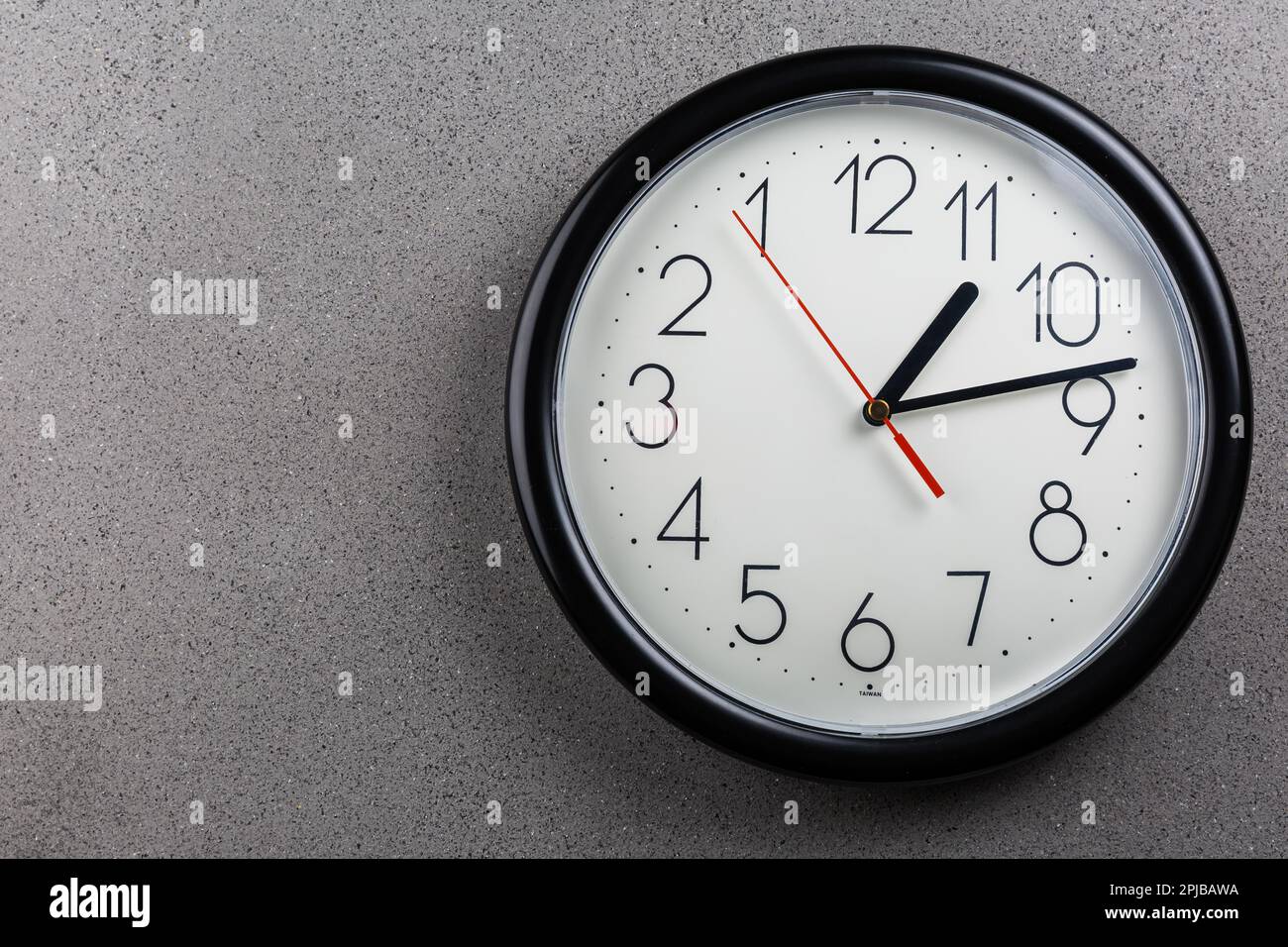 Turn back time concept of turning clock backwards Stock Photo Alamy
