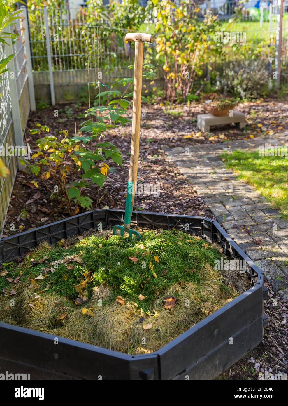 Making compost in composting bin in small garden Stock Photo Alamy