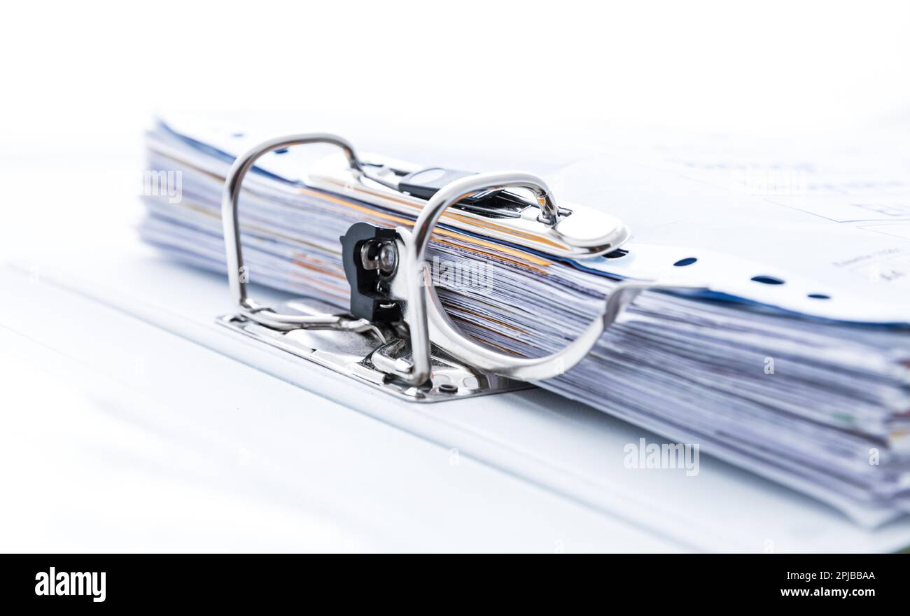 Detail of open folder filled with documents. Symbol of business or bureaucracy Stock Photo