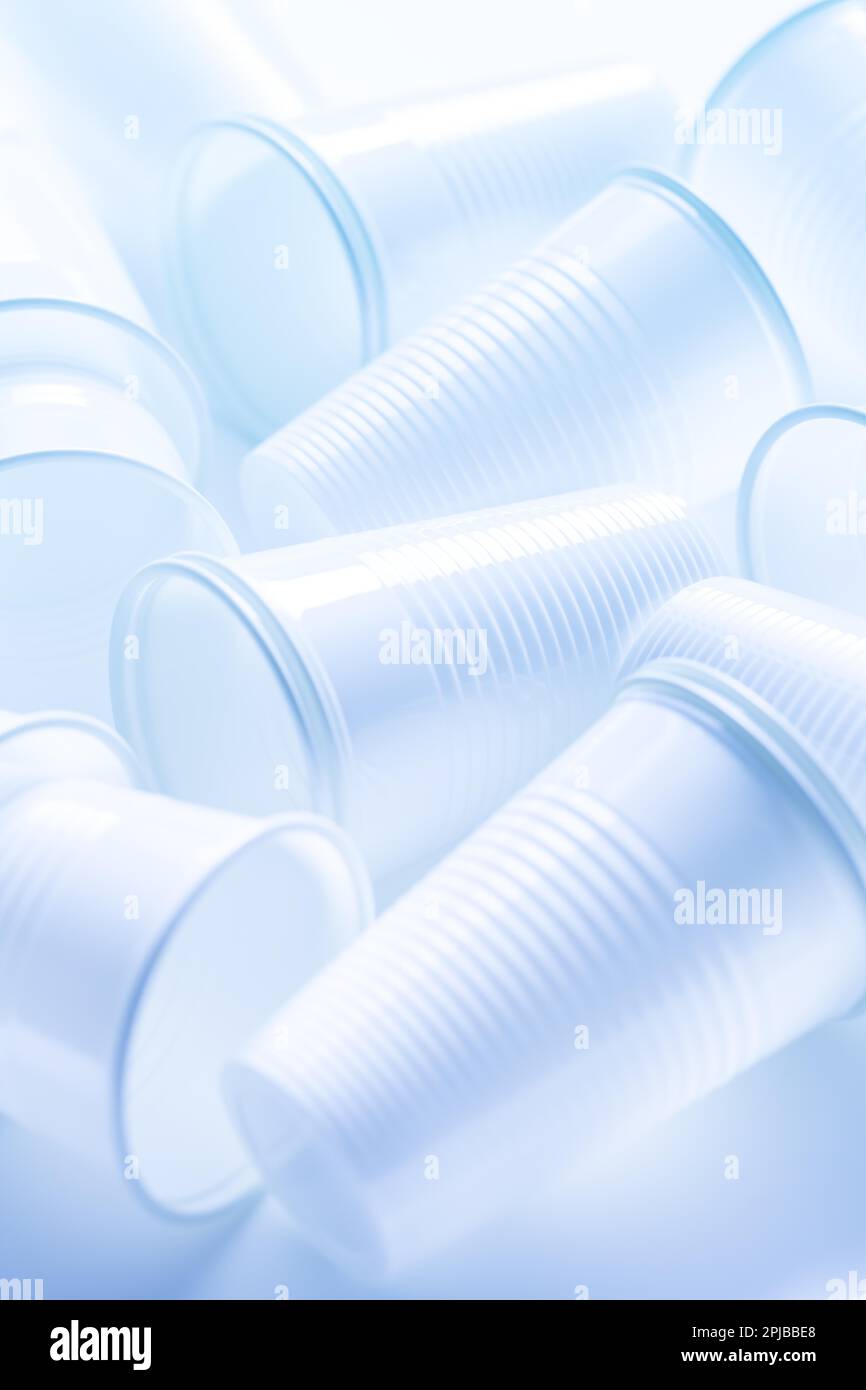 Disposable white plastic cups as background. Environmental concept. Non