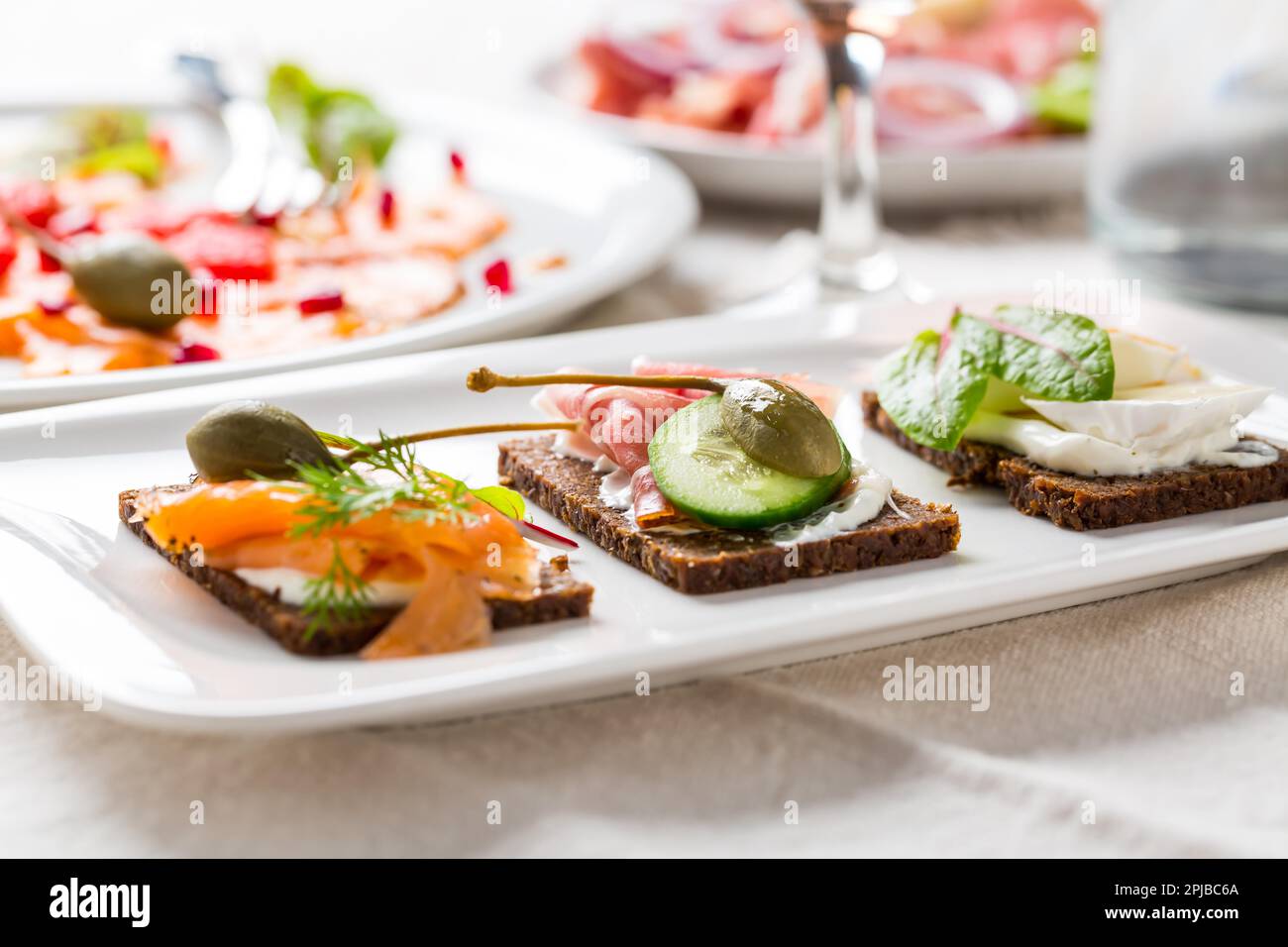 Variation of healthy open sandwiches on Pumpernickel bread with ...