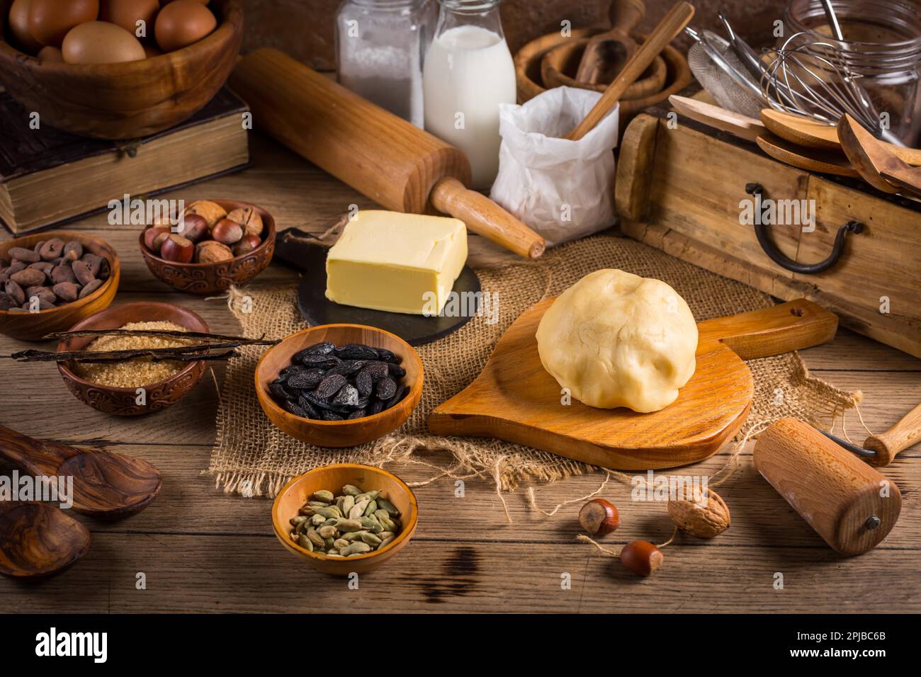 https://c8.alamy.com/comp/2PJBC6B/assortment-of-baking-ingredients-and-kitchen-utensils-in-vintage-wooden-style-christmas-baking-concept-2PJBC6B.jpg