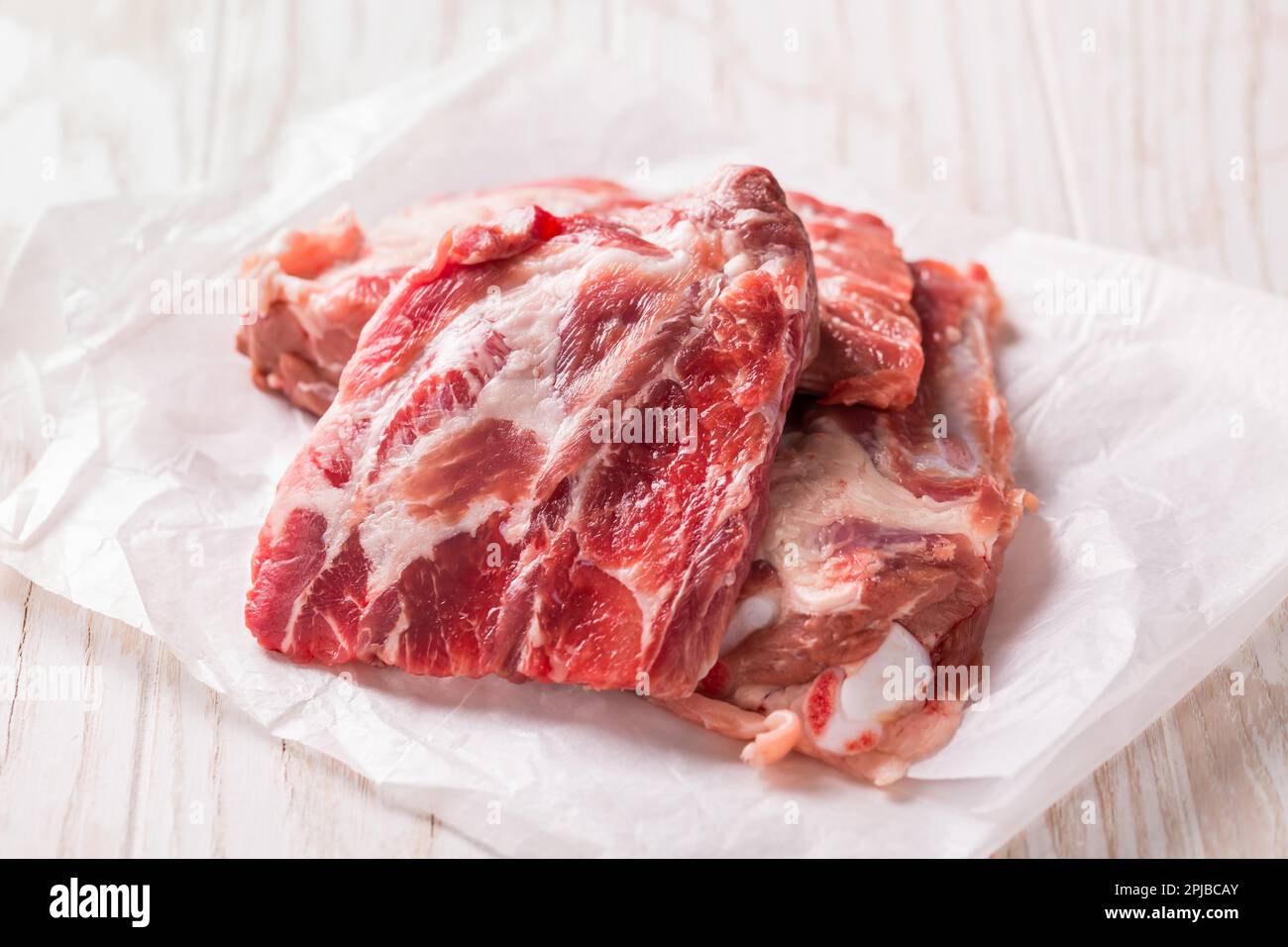 Raw spare ribs on white background, ready for cooking Stock Photo