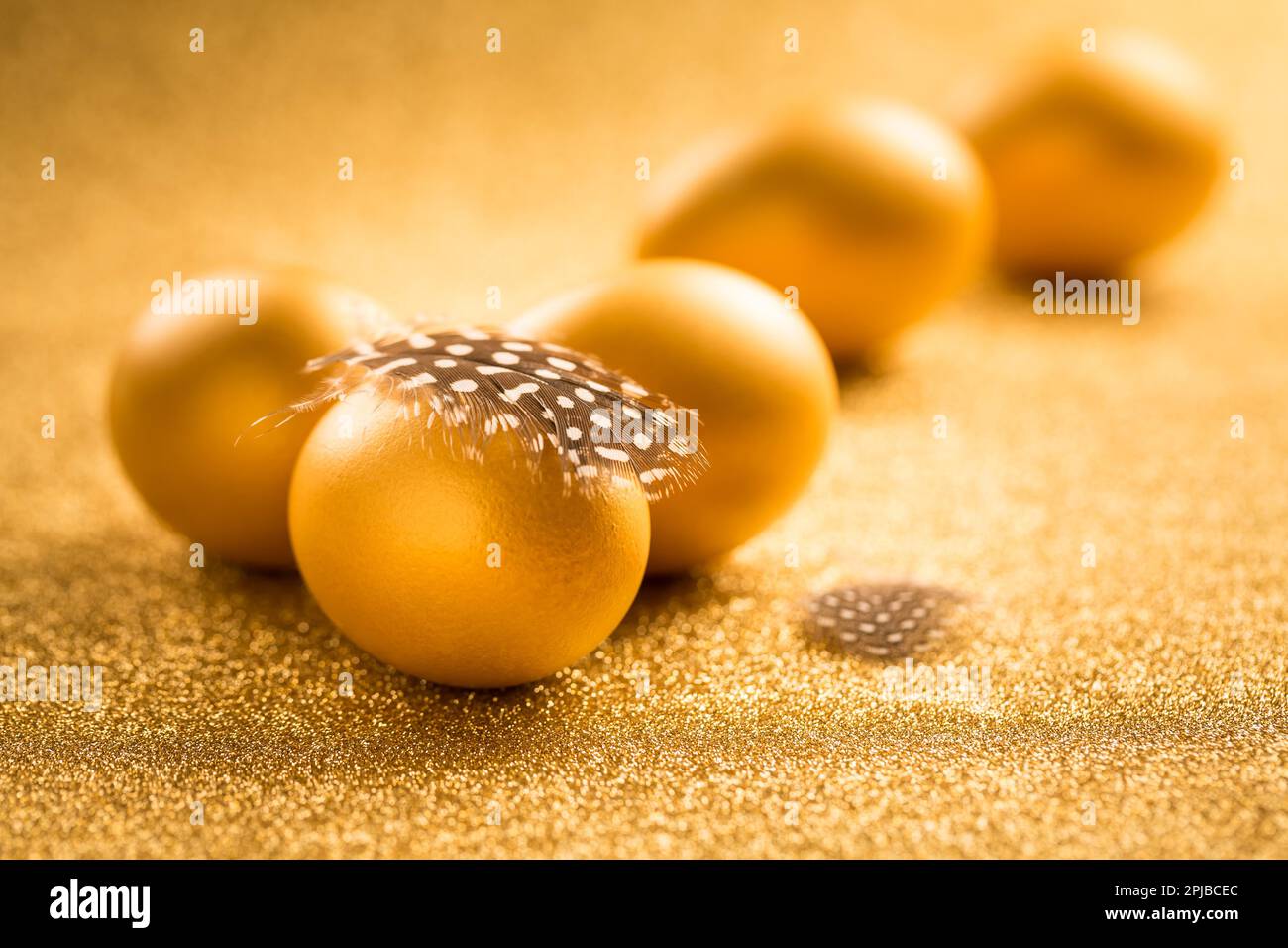 Golden eggs on golden background for Easter Stock Photo