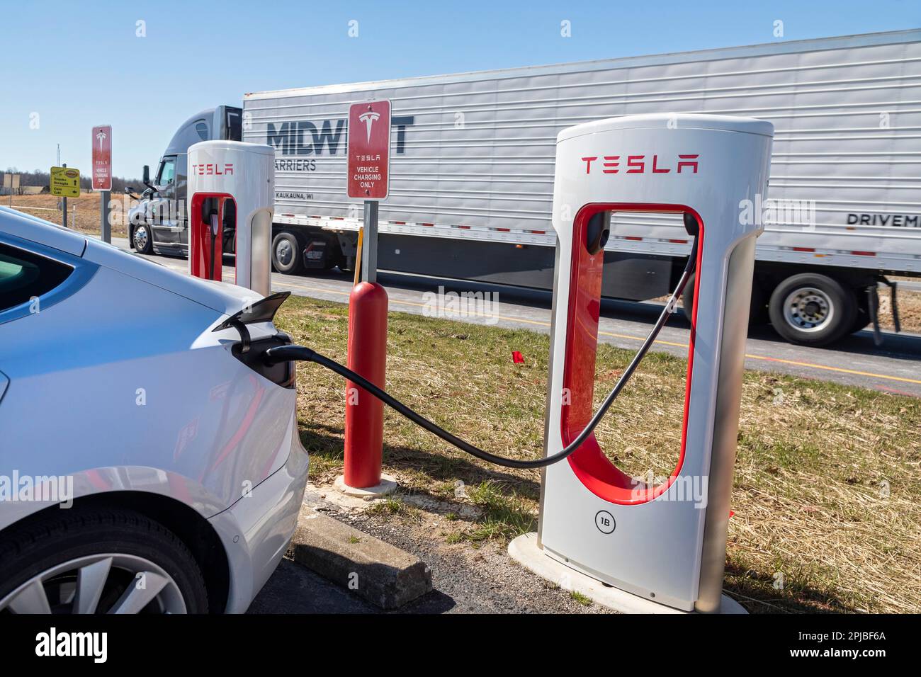 Beaver Dam, Kentucky, A car charges at a Tesla charging station in a