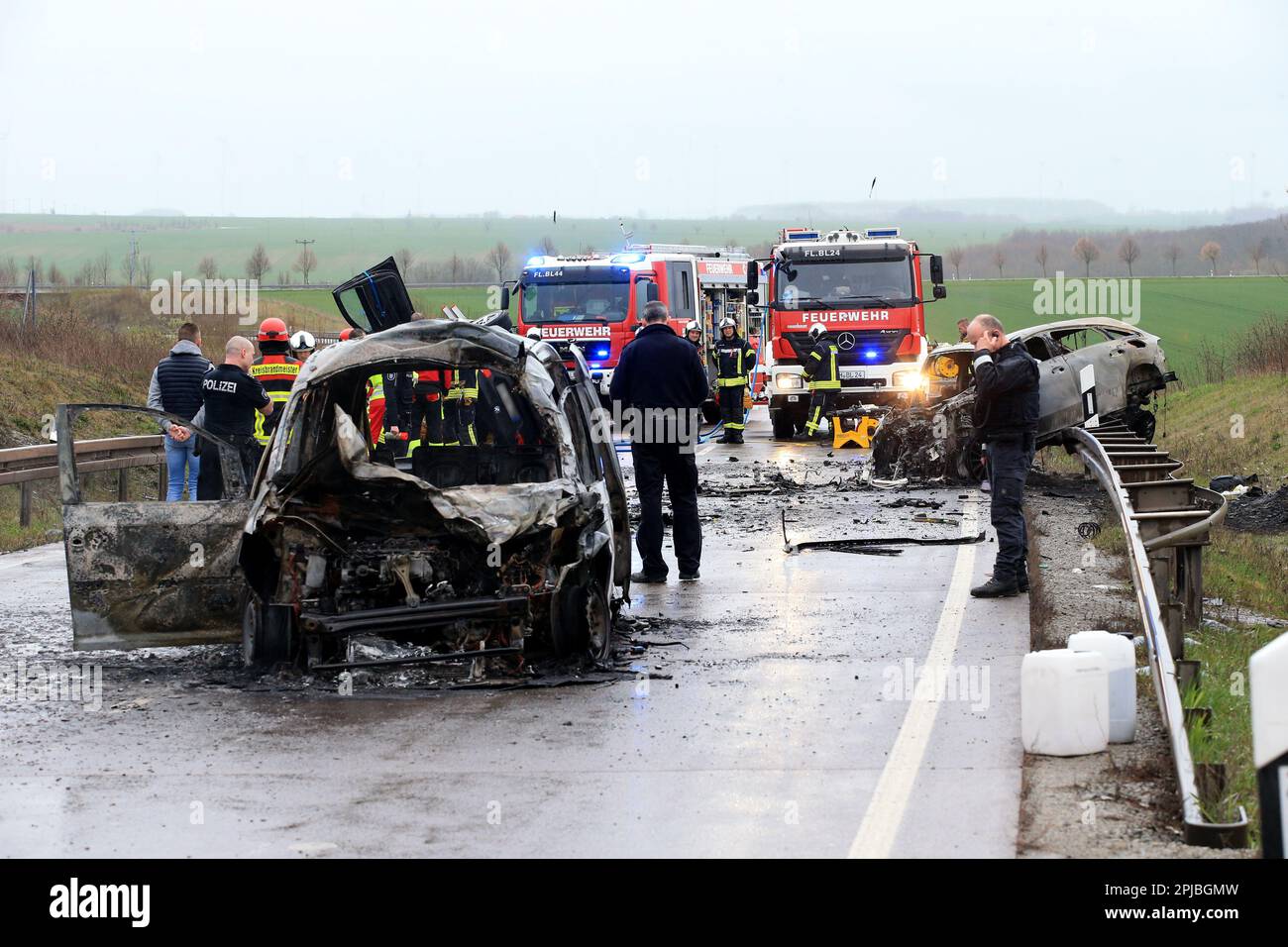 Bad Langensalza, Germany. 01st Apr, 2023. Two burnt-out cars stand at the scene of the accident on the B247 near Bad Langensalza. According to police, several people were killed in a serious traffic accident in northern Thuringia late on Saturday afternoon. The accident involved three vehicles, two of which caught fire. Credit: Silvio Dietzel/dpa-Zentralbild/dpa/Alamy Live News Stock Photo