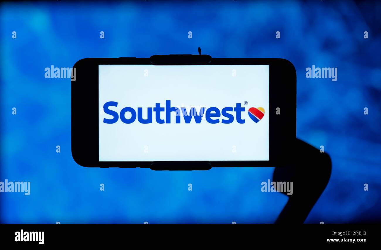 In this photo illustration, the southwest airlines logo is seen displayed on a mobile phone screen. Stock Photo