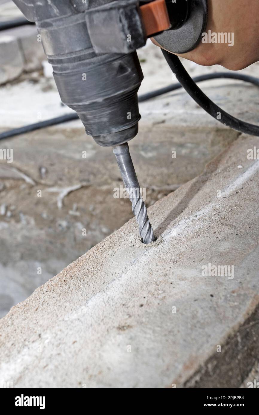 drill a hole in concrete Stock Photo Alamy