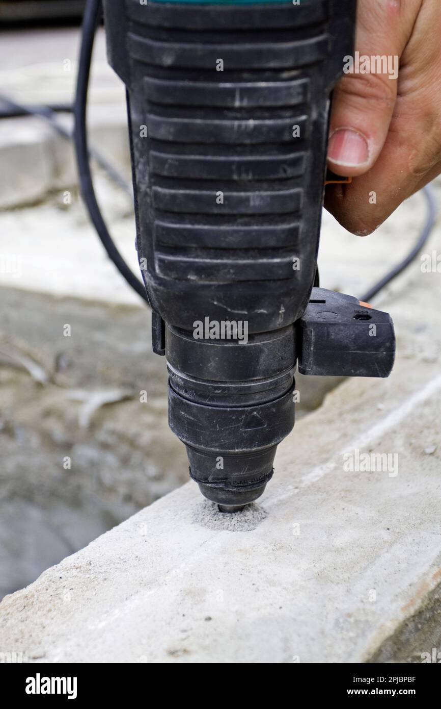 drill a hole in concrete Stock Photo Alamy