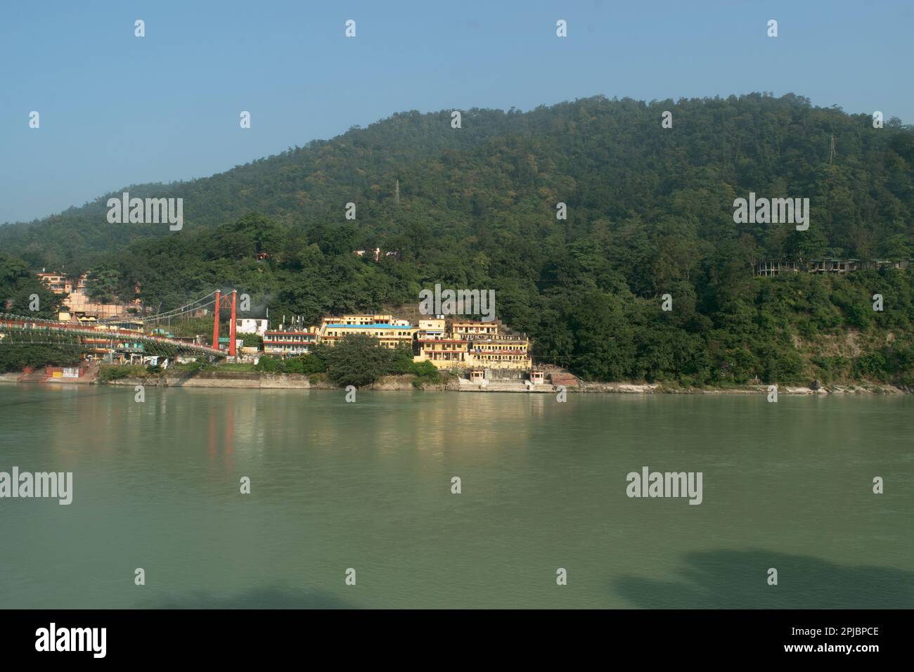 Ganga river with green mountains at rishikesh, uttarakhand Stock Photo