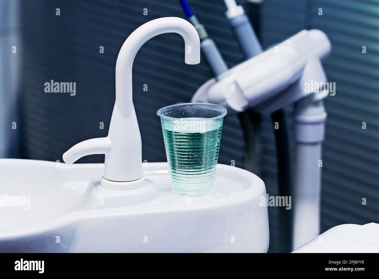 the office at the dentist rinsing water for teeth Stock Photo Alamy