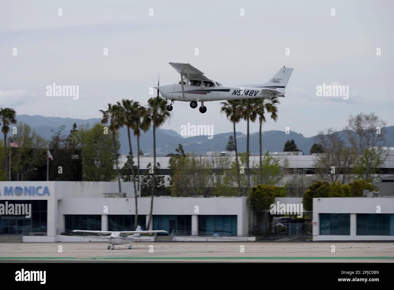 Santa Monica, California, USA. 31st Mar, 2023. A Cessna 172 (N5148V) single engine airplane doing a go-around after aborting a landing approach on Runway 21.Santa Monica Airport (ICAO: KSMO) is a general aviation airport serving FBOs, flight schools and hobbyists. Its location near residential areas and it's short runway have caused controversy and led to efforts to close the airport. The FAA announced the airport will close in 2028 to be converted into a public park. The airport has a rich history, having been used for aviation purposes since 1917 where it was home to the Douglas Stock Photo
