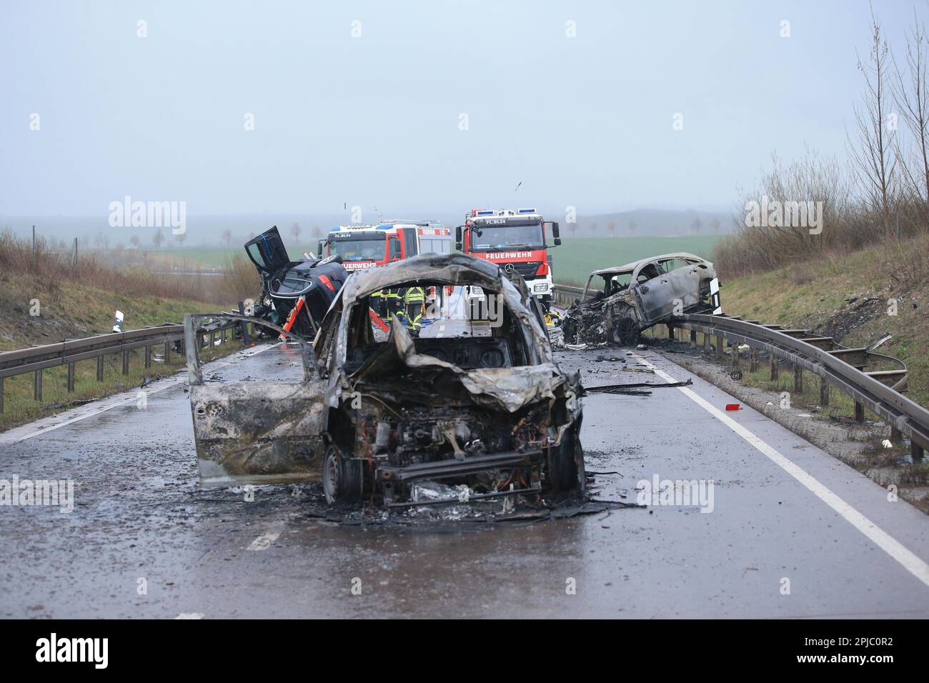 Bad Langensalza, Germany. 01st Apr, 2023. Two burnt-out cars stand at the scene of the accident on the B247 near Bad Langensalza. According to police, several people were killed in a serious traffic accident in northern Thuringia late on Saturday afternoon. The accident involved three vehicles, two of which caught fire. Credit: Silvio Dietzel/dpa-Zentralbild/dpa/Alamy Live News Stock Photo