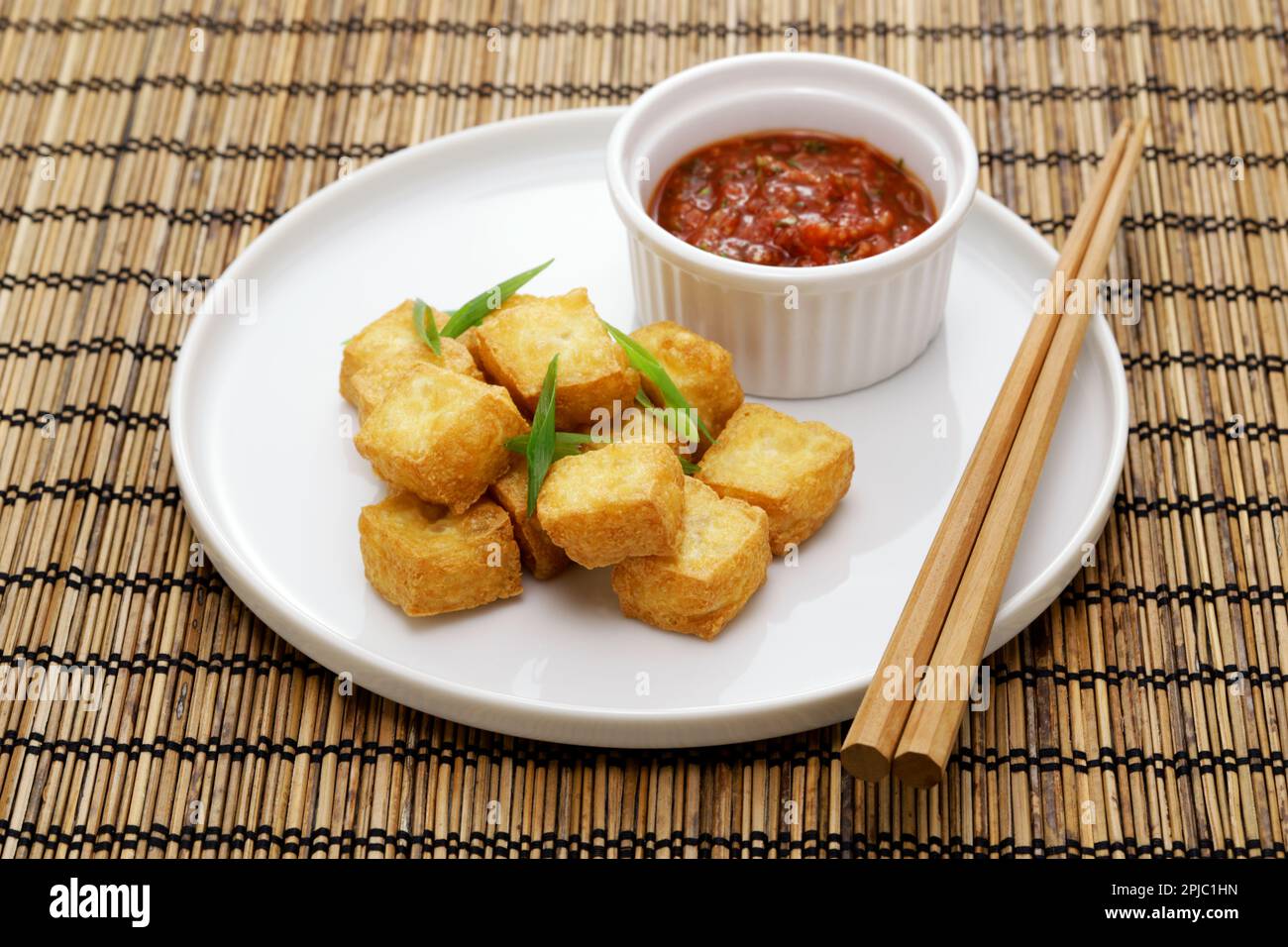 crispy cubed tofu puffs with chili sauce Stock Photo Alamy