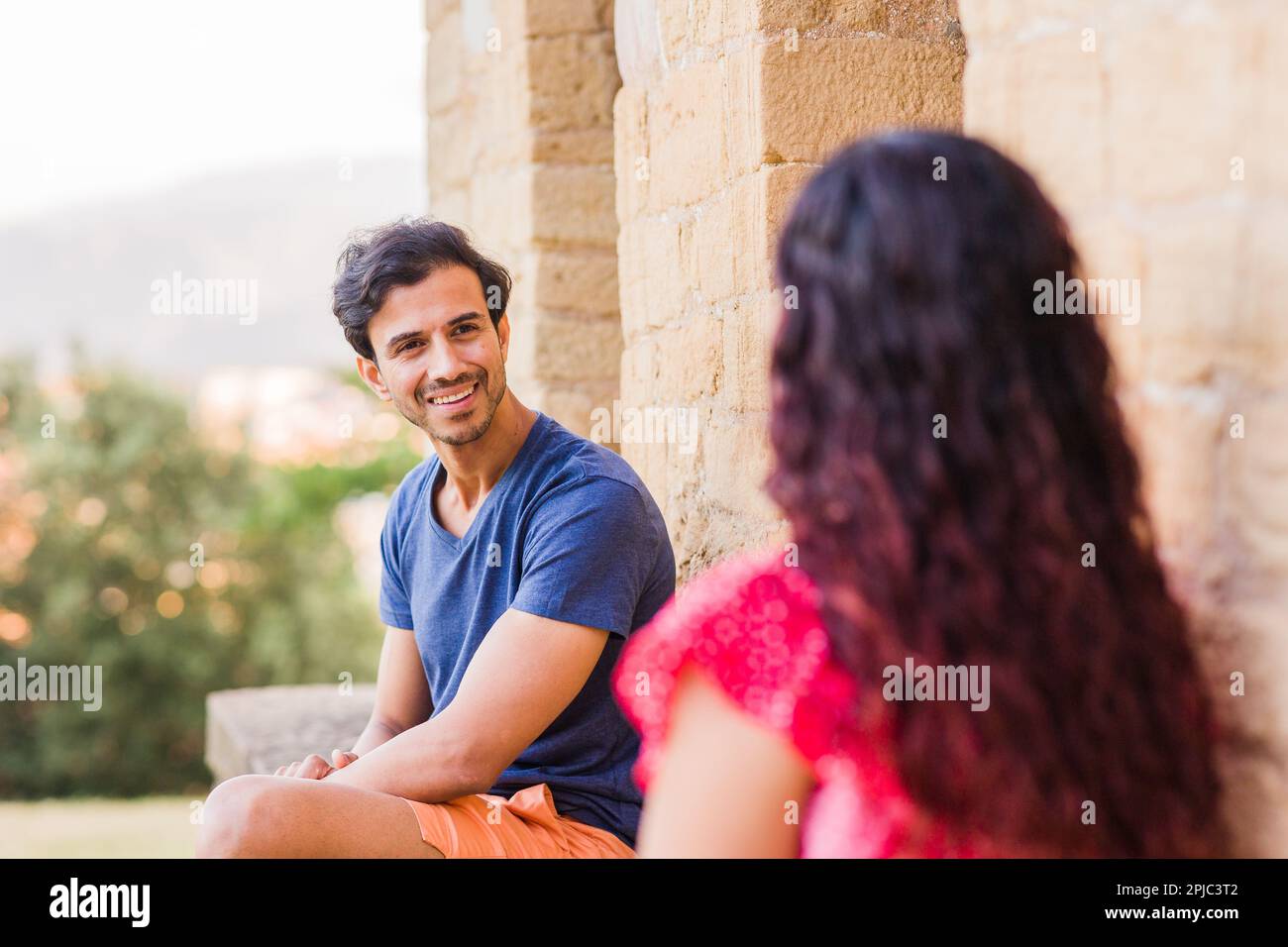 Multiethnic middle aged couple talking and laughing happy conversation ...