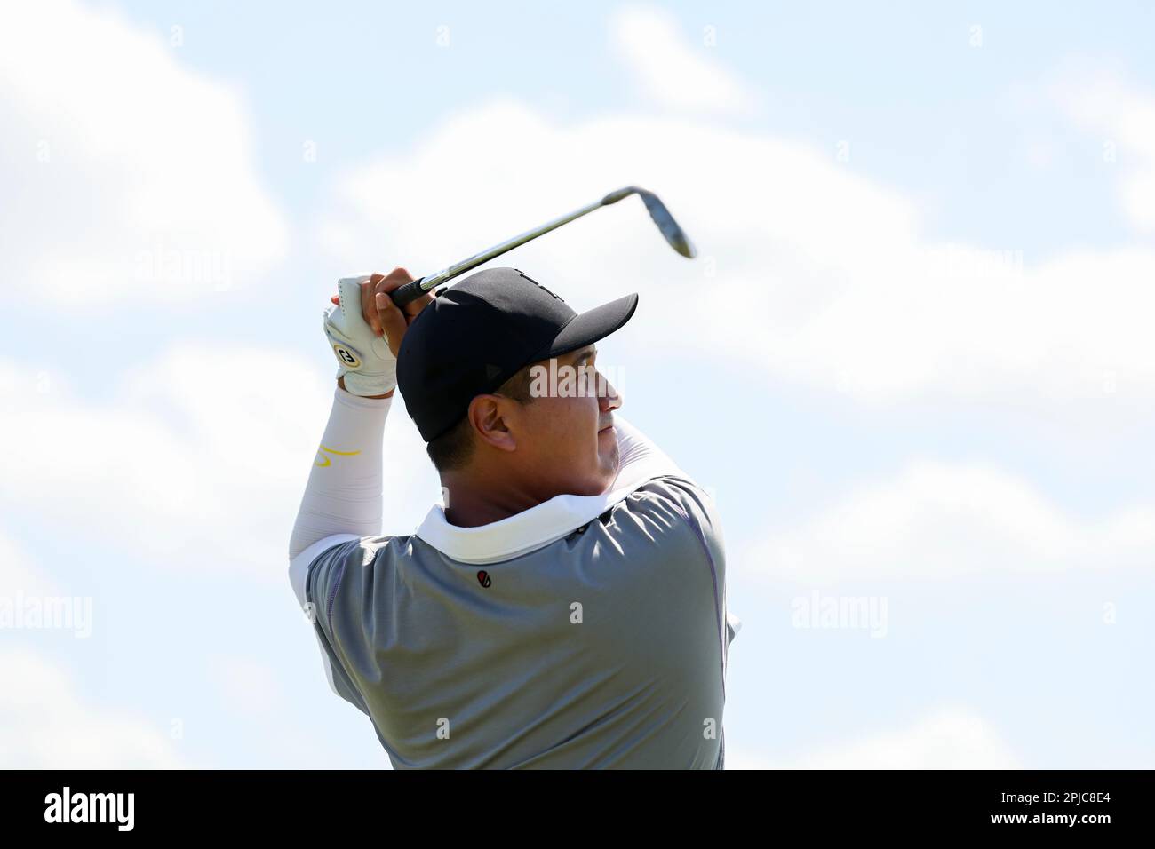 Sihwan Kim of Iron Heads GC hits his shot on the driving range during