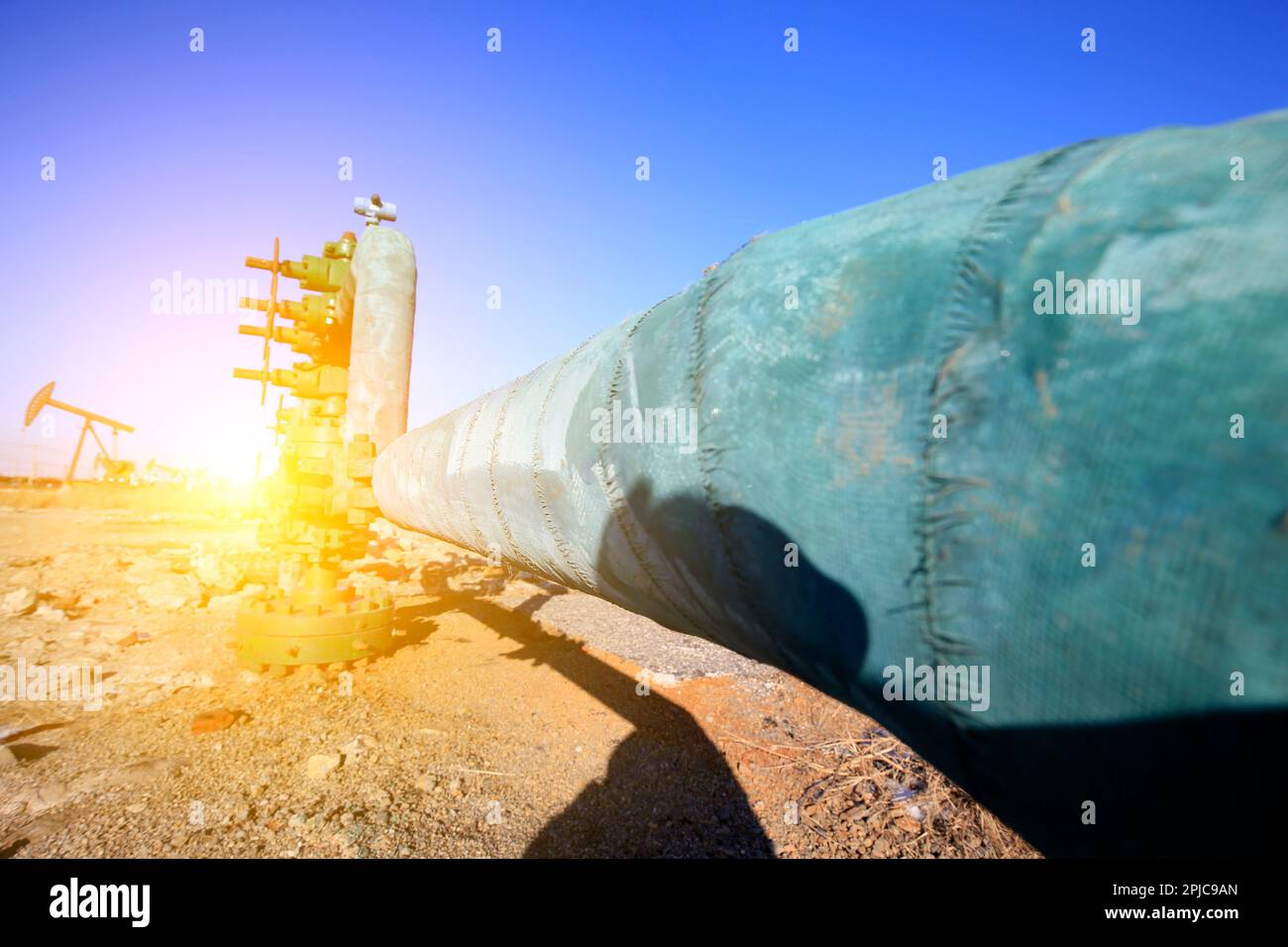 Tube and valve, oil industry equipment Stock Photo - Alamy