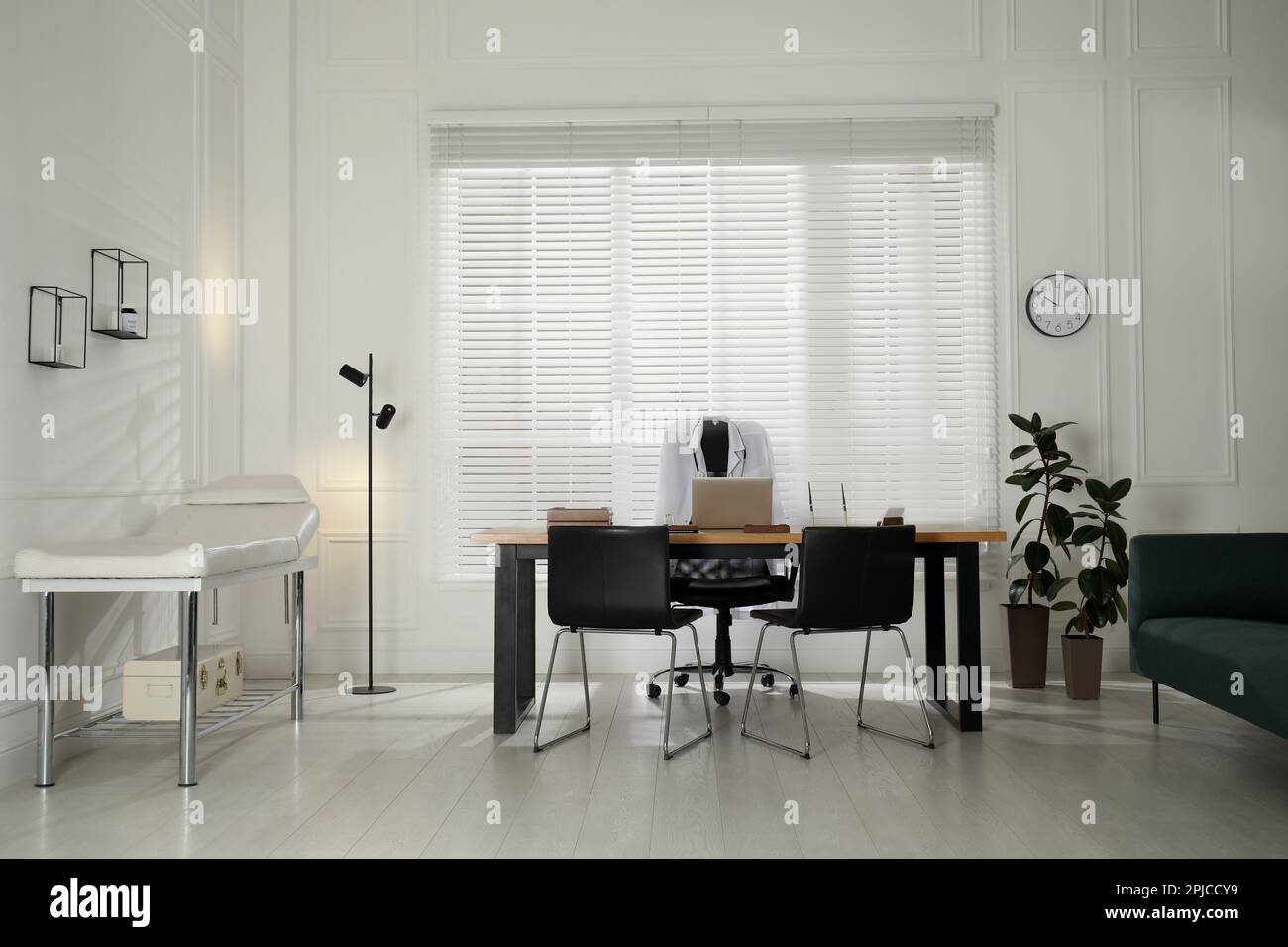 Modern medical office interior with doctor's workplace and examination ...