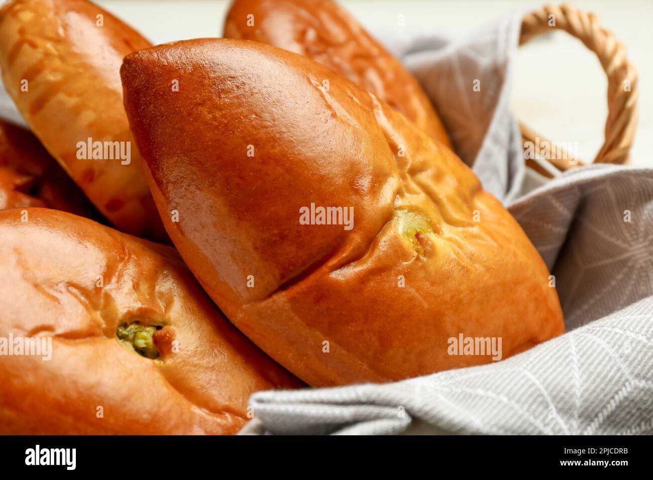 Basket with delicious baked patties, closeup view Stock Photo