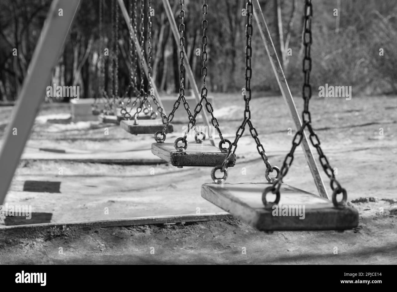 Wooden swings in park. Black and white effect Stock Photo Alamy