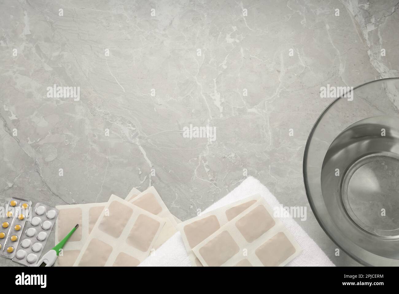 Flat lay composition with mustard plasters on light grey marble table ...