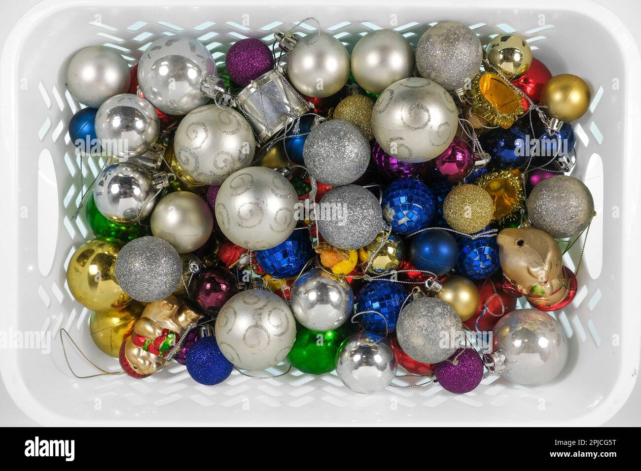Christmas baubles in palstic basket Stock Photo