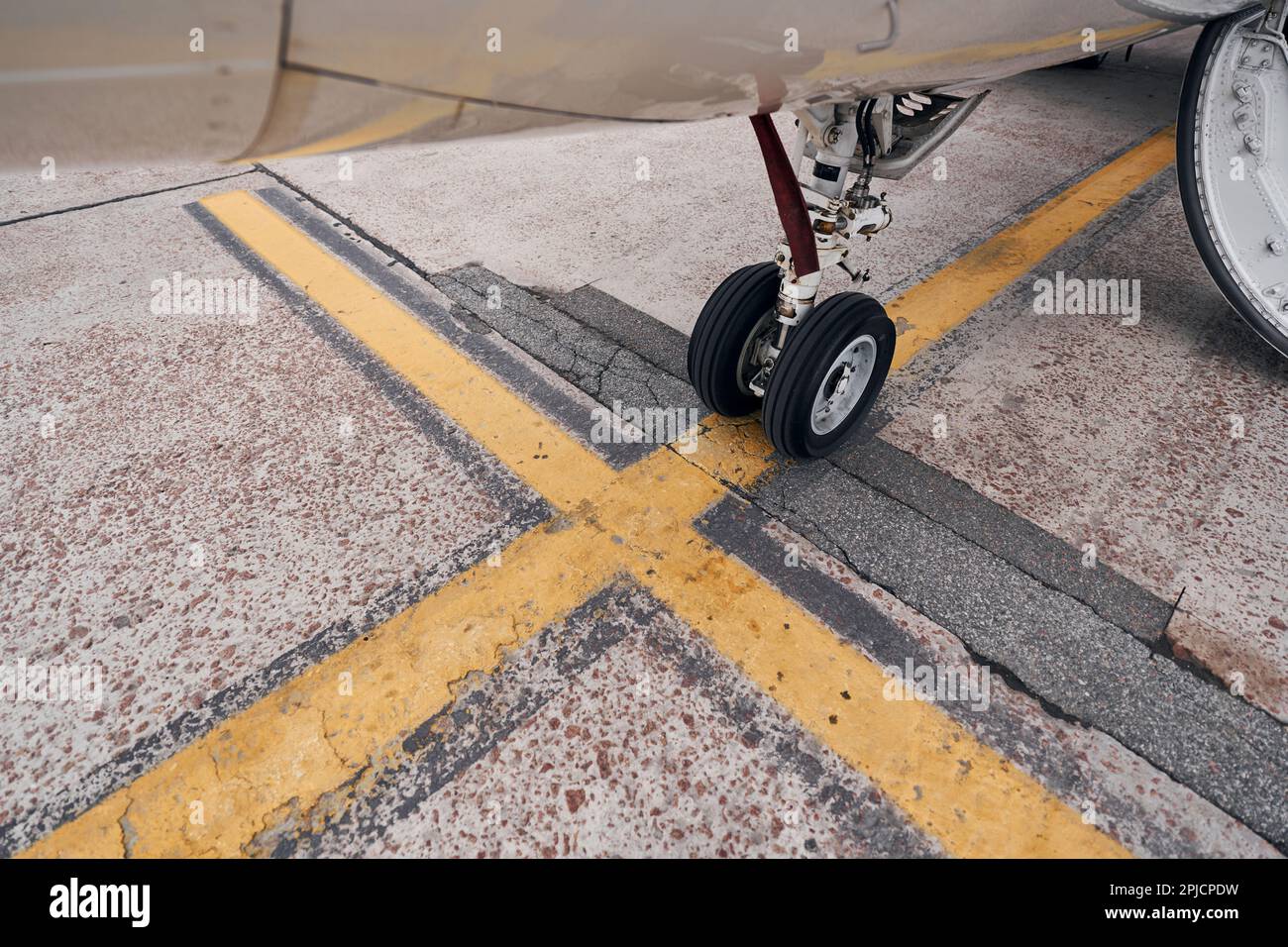 Turboprop aircraft parked on the runway at daytime Stock Photo - Alamy