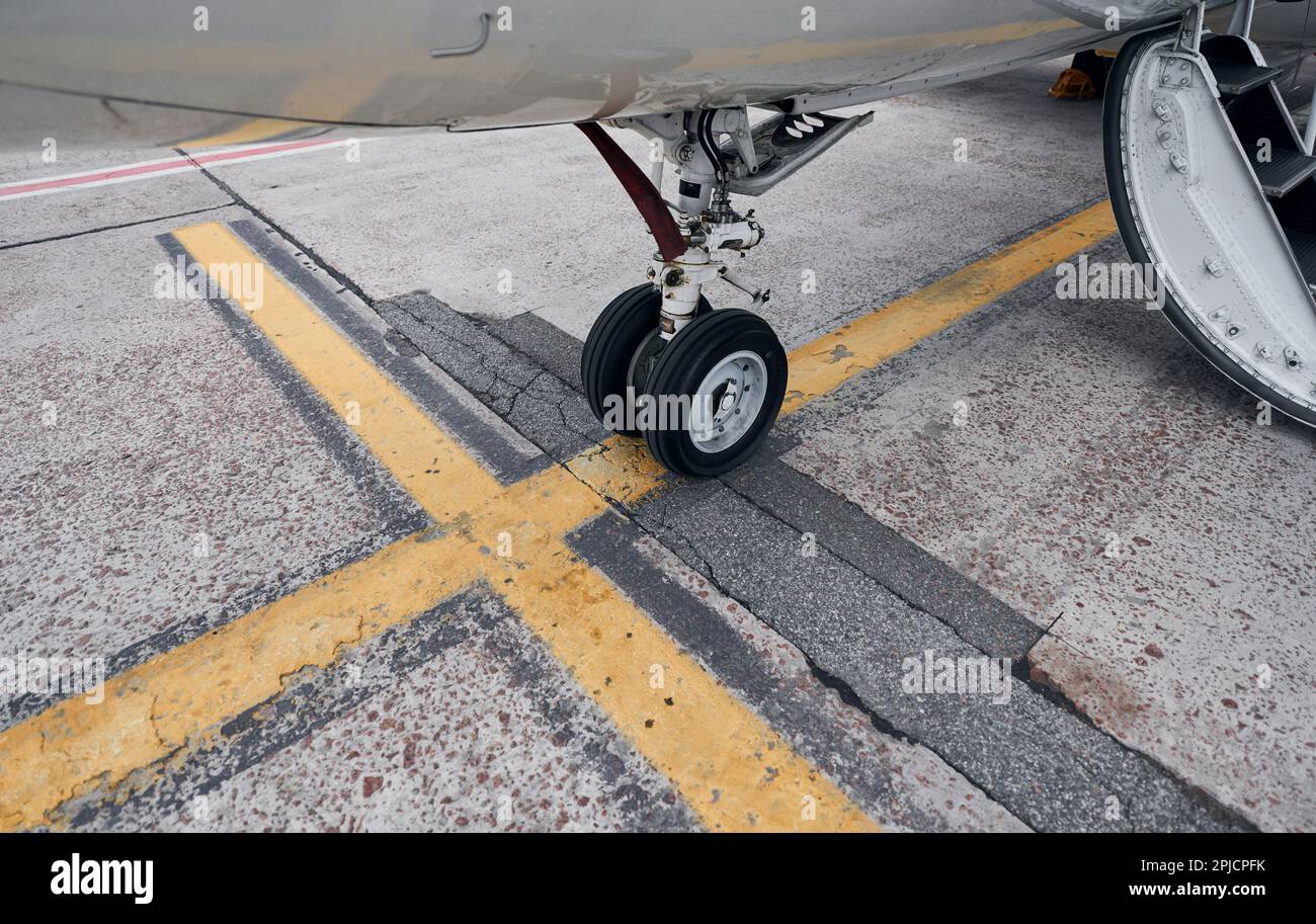 Turboprop aircraft parked on the runway at daytime Stock Photo - Alamy