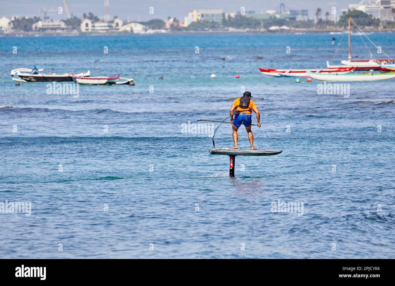 Oahu, Hawaii, USA, February 6, 2023 Adult man on an Electric
