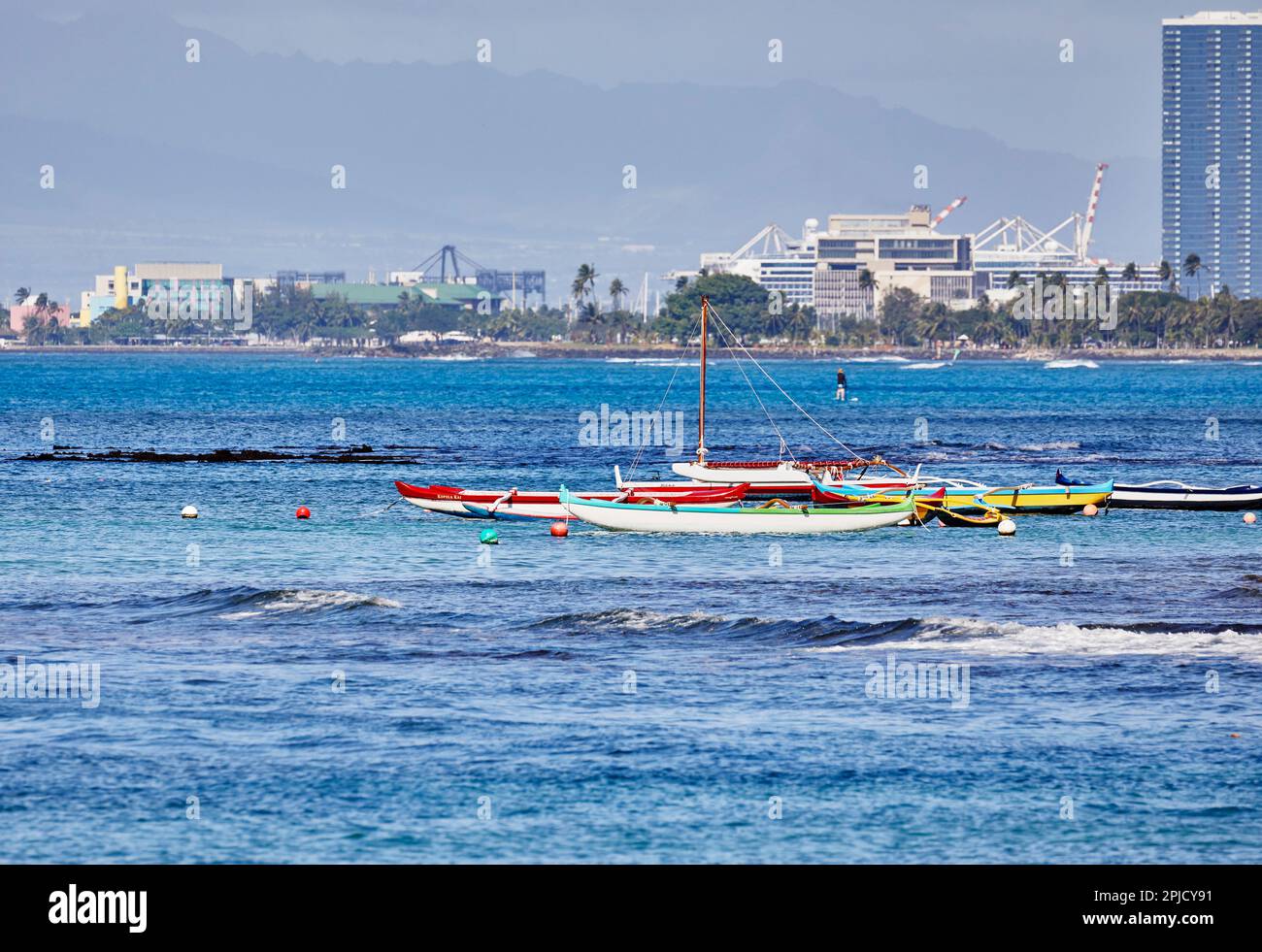 Honolulu, Oahu, Hawaii, USA, - February 6, 2023: Kayaks floating in shallow water Stock Photo