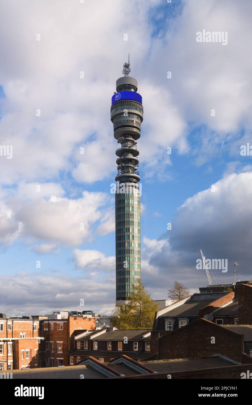 London, UK -February 27, 2023; BT Tower landmark rising against blue sky with partially cloudy over buildings Stock Photo