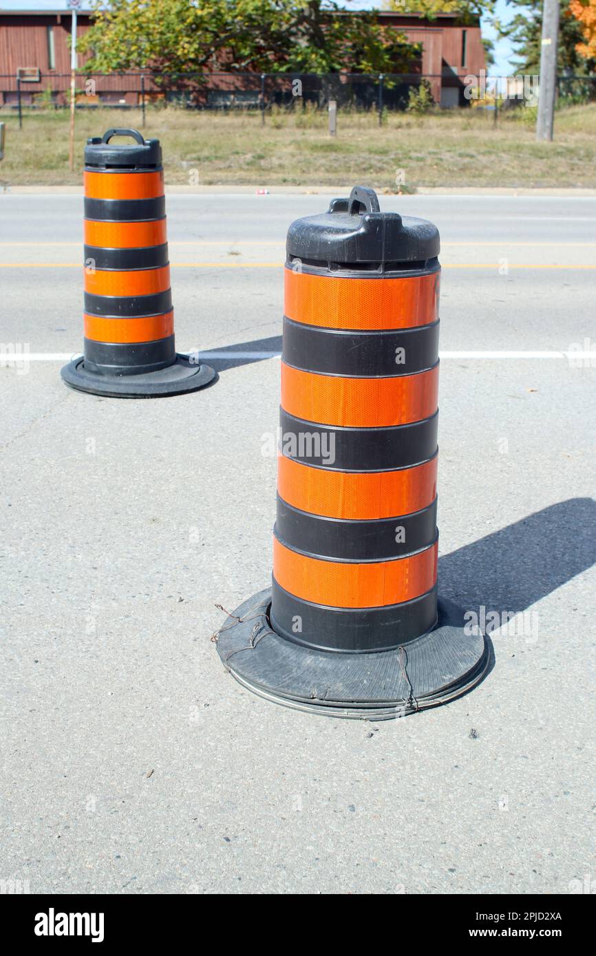 Two traffic construction warning pylons on roadway Stock Photo Alamy