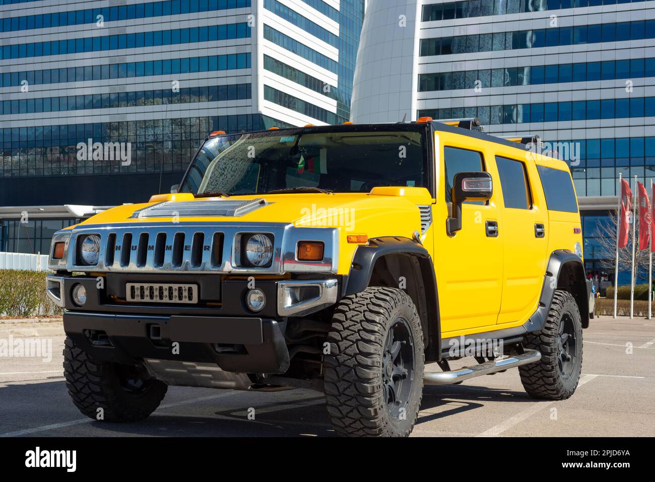 Yellow Hummer H2 outside the Capital Fort office building in Sofia, Bulgaria, Eastern Europe, Balkans, EU Stock Photo