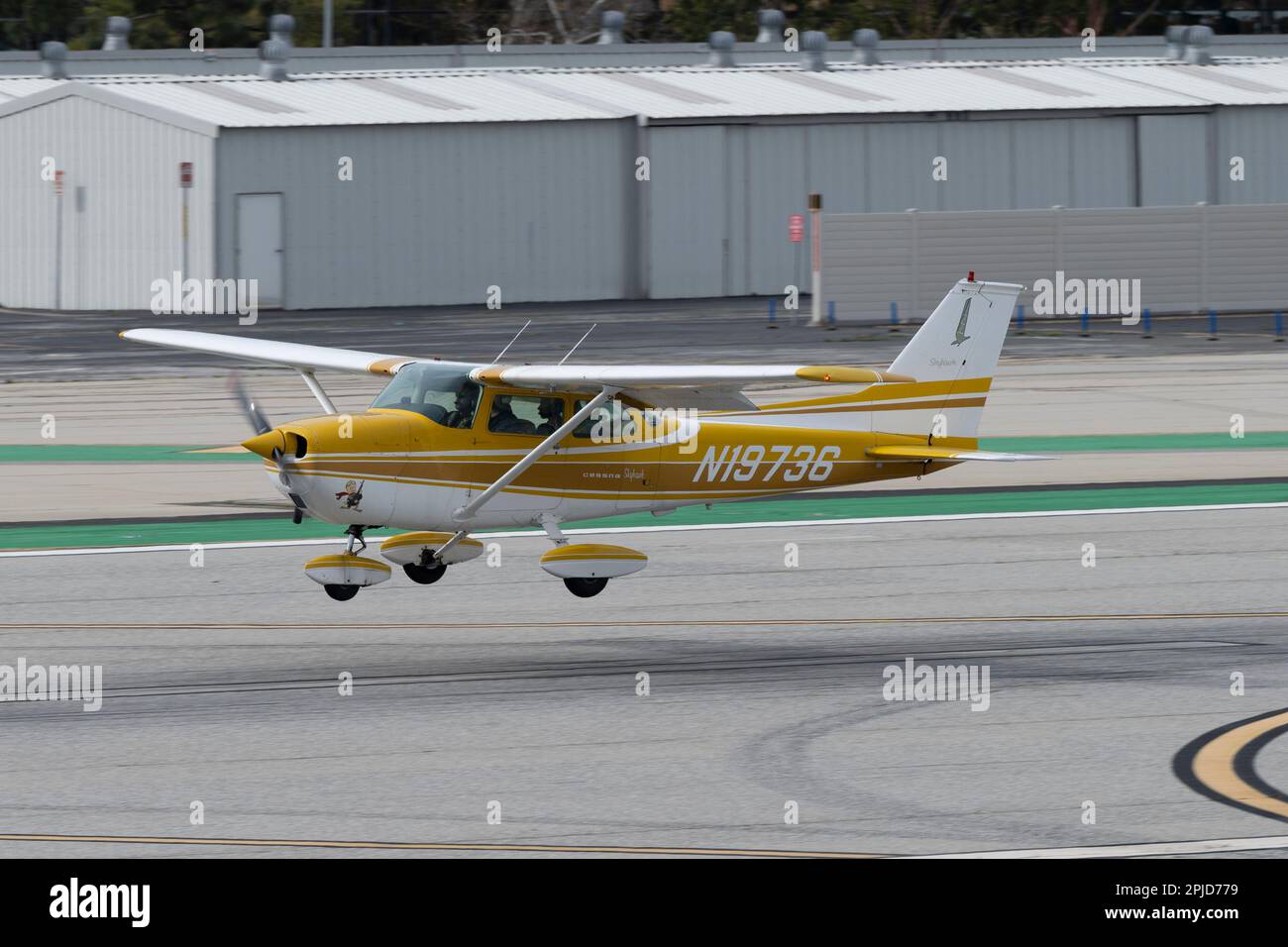 Santa Monica, California, USA. 31st Mar, 2023. A Cessna 172 Skyhawk in yellow paint.Santa Monica Airport (ICAO: KSMO) is a general aviation airport serving FBOs, flight schools and hobbyists. Its location near residential areas and it's short runway have caused controversy and led to efforts to close the airport. The FAA announced the airport will close in 2028 to be converted into a public park. The airport has a rich history, having been used for aviation purposes since 1917 where it was home to the Douglas Aircraft Corporation. In the early days of aviation, the airport served a Stock Photo