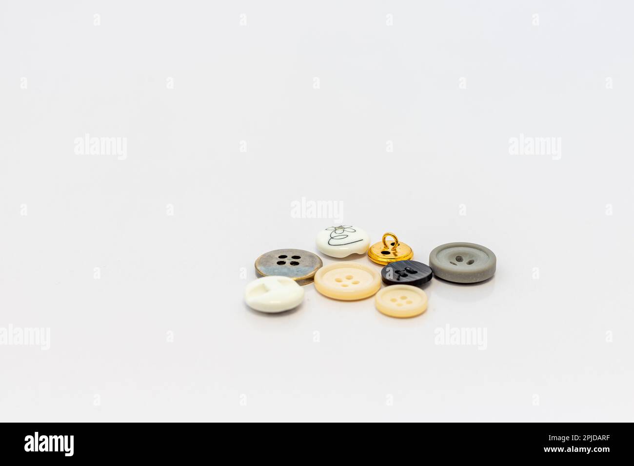 Buttons for clothes on white background. selective focus Stock Photo