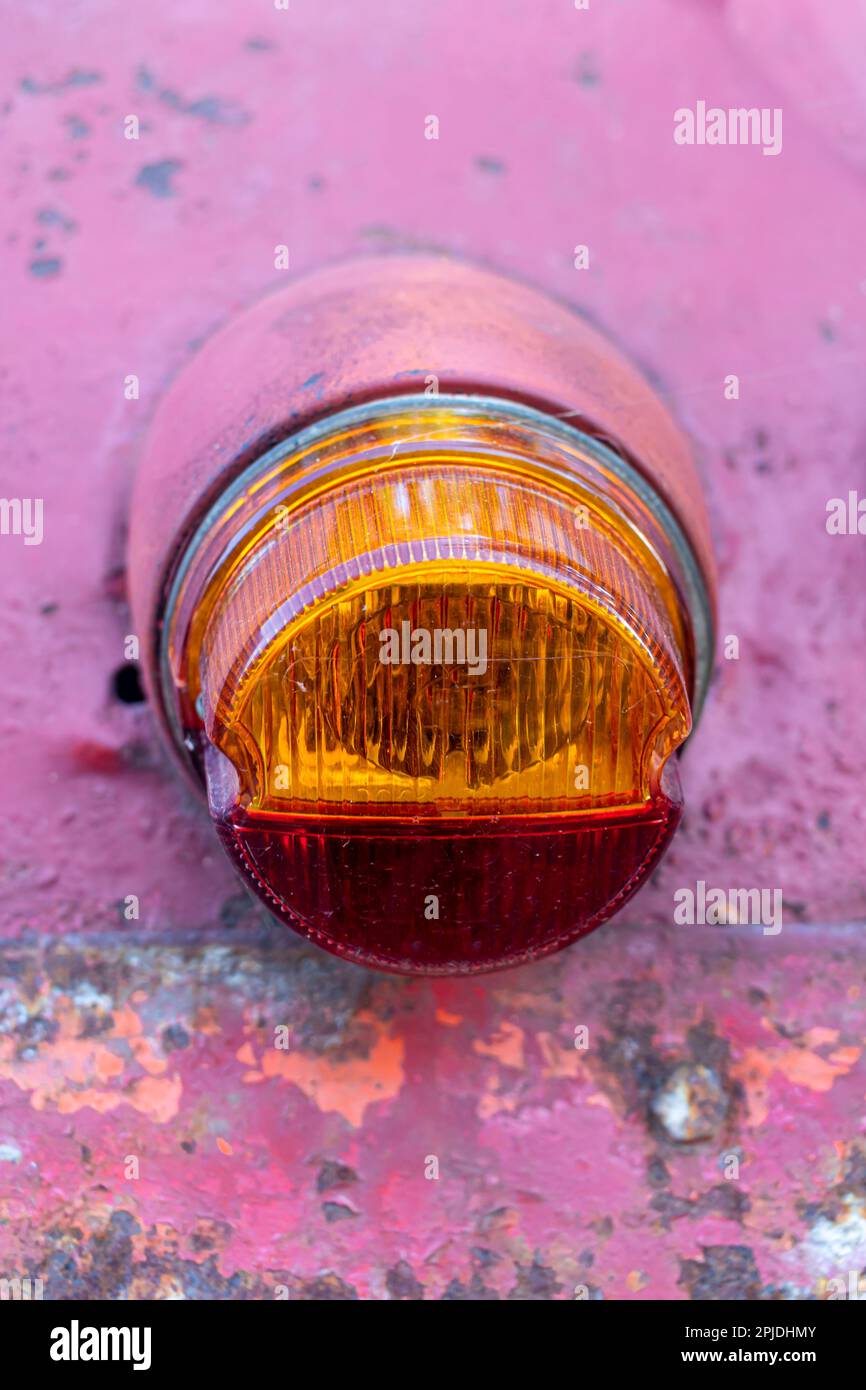 taillight on an old car. Turn signal and brake light. Car body in poor