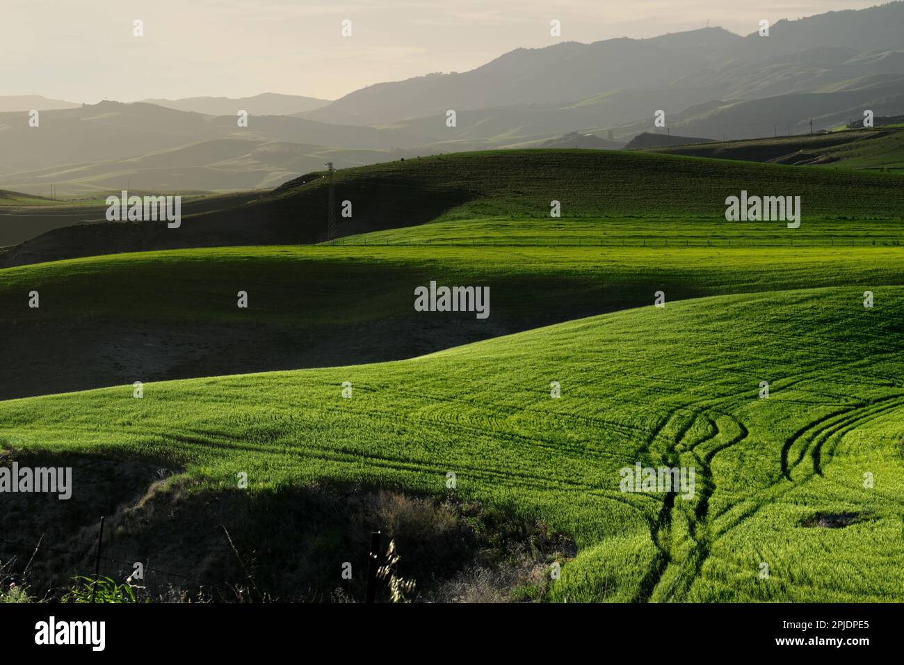 sunlight and dark shadows on rolling hills in Sicily, Italy Stock Photo