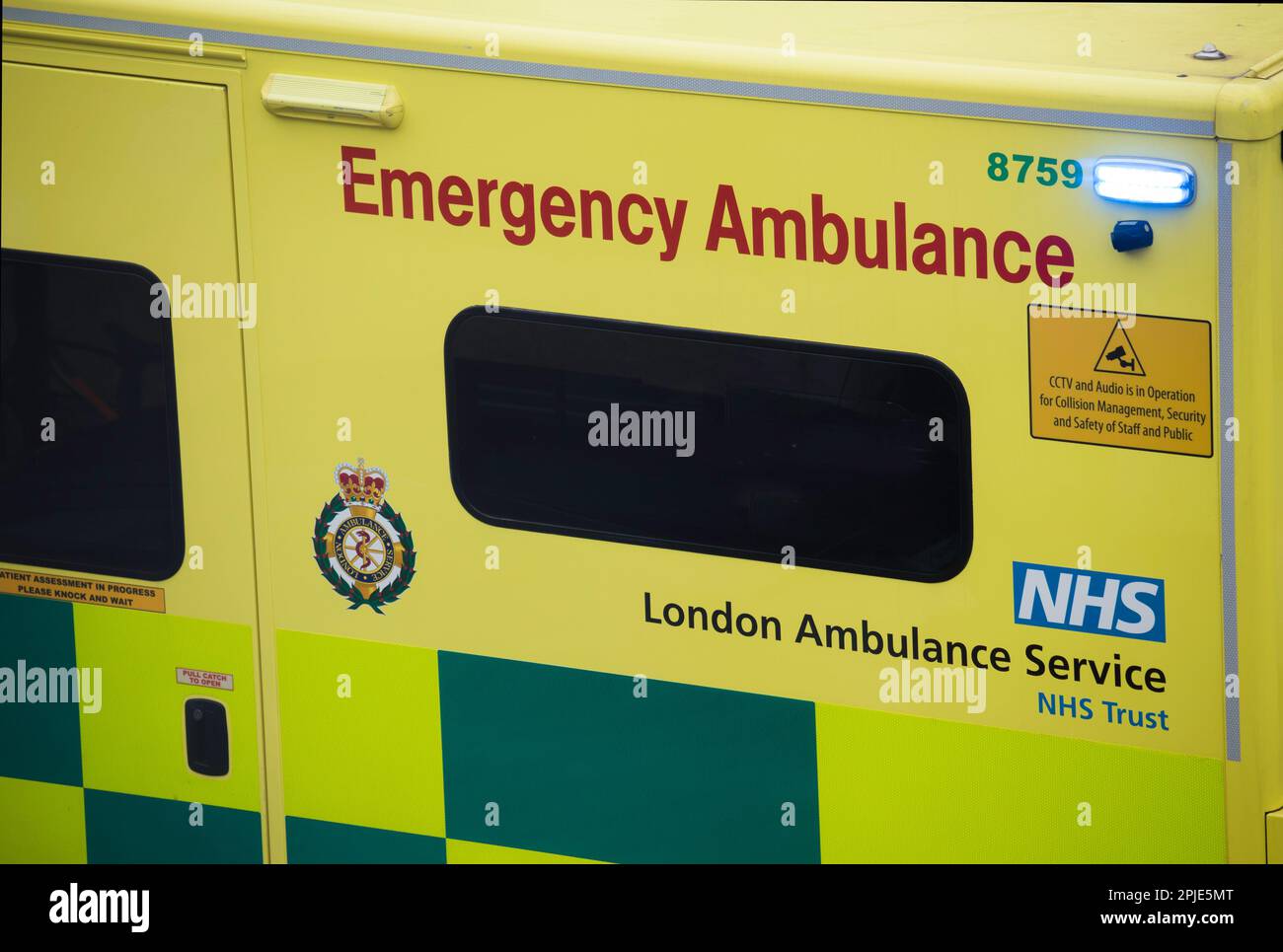 Close up of London Ambulance with blue emergency lights Stock Photo