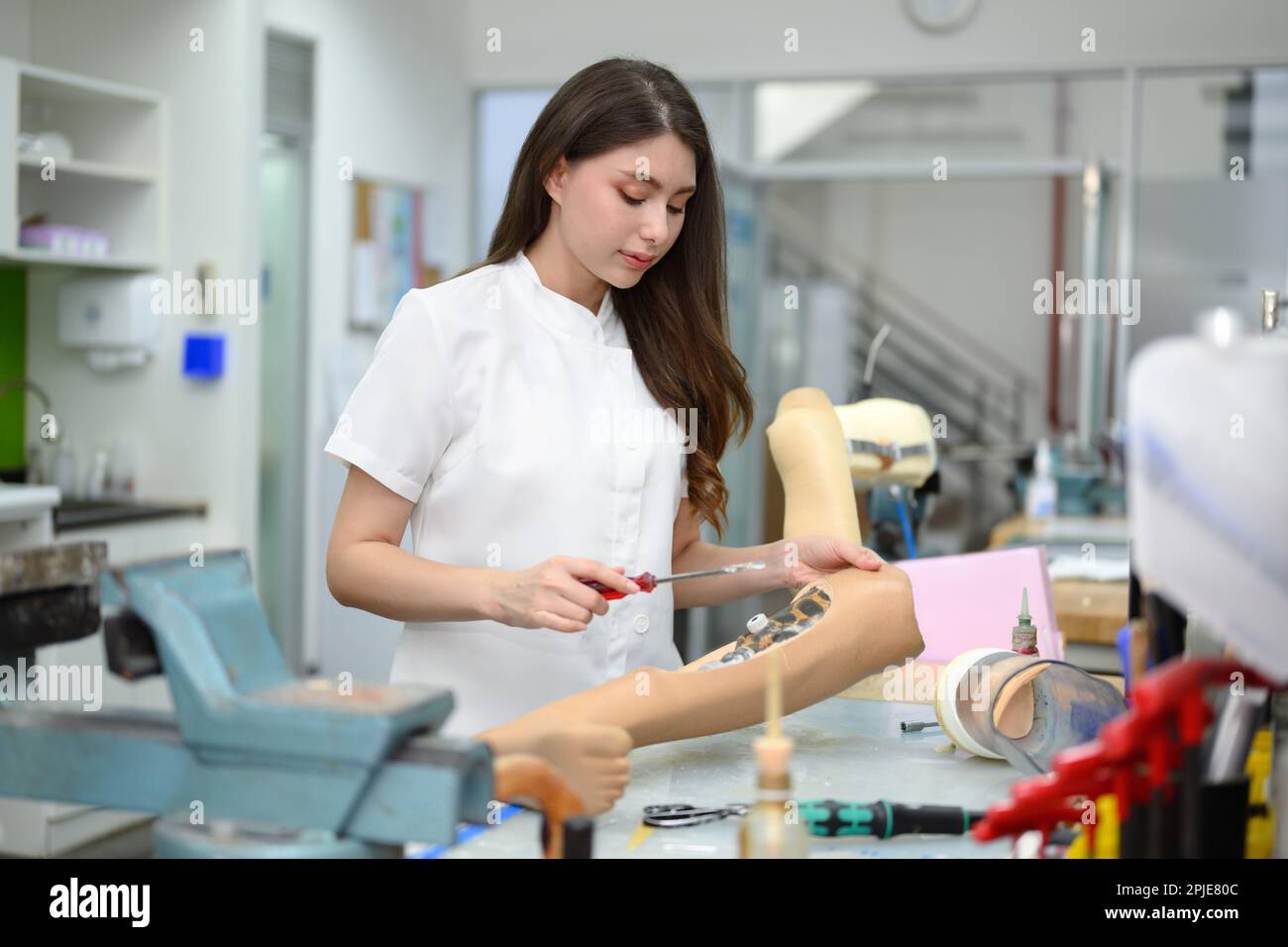 Technician Making Prototype Of Prosthetic Leg, Artificial Metal Limb ...