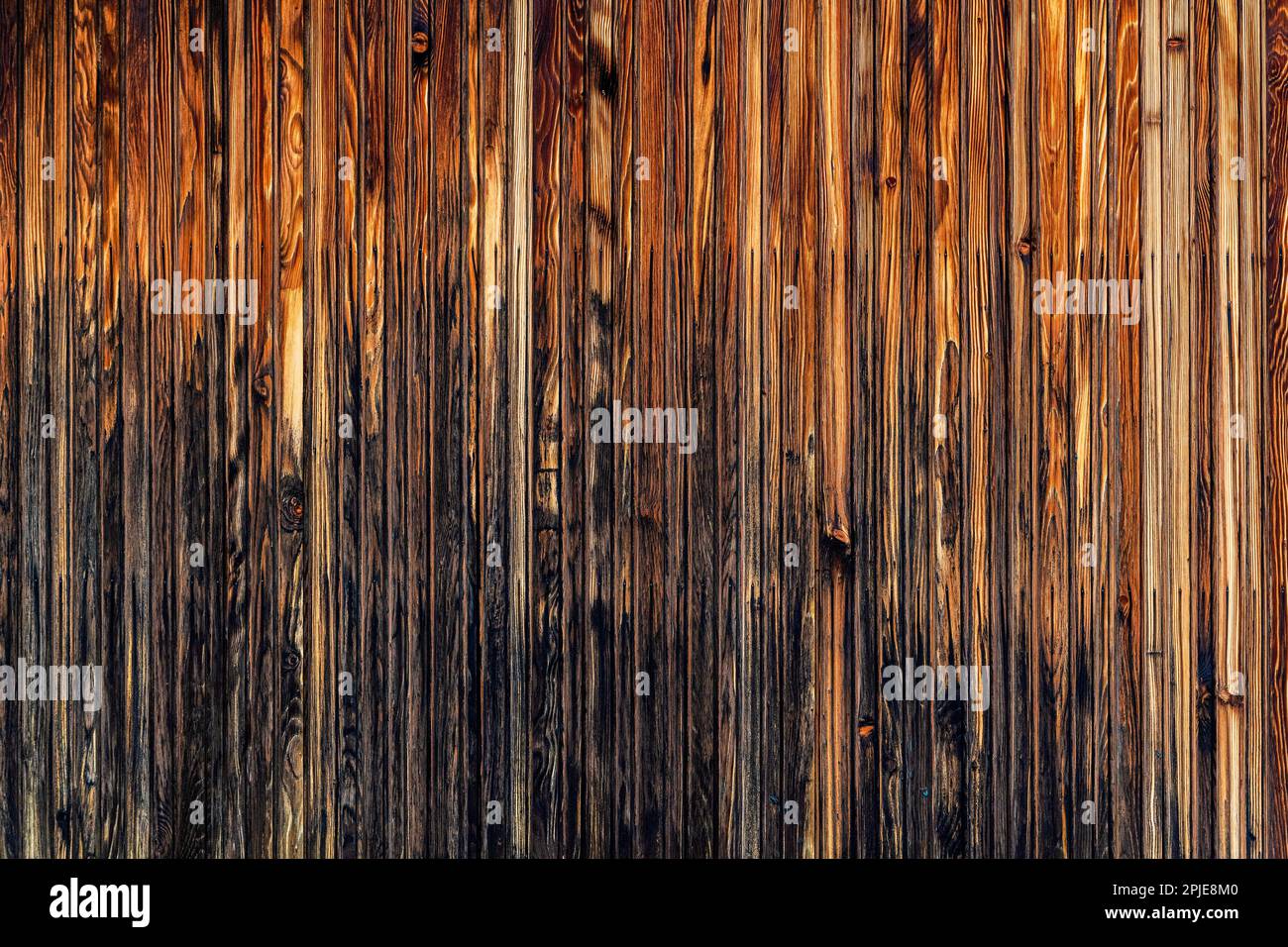 Worn old wooden facade of prefabricated house as background Stock Photo