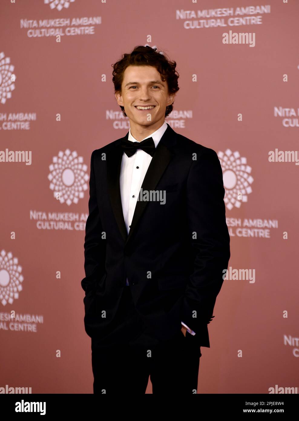 English actor Tom Holland reacts during a photo shoot on the red carpet during the second day of the opening of Nita Mukesh Ambani Cultural Centre in Mumbai, India, 01 April, 2023. (Photo by Indranil Aditya/NurPhoto)0 Credit: NurPhoto SRL/Alamy Live News Stock Photo