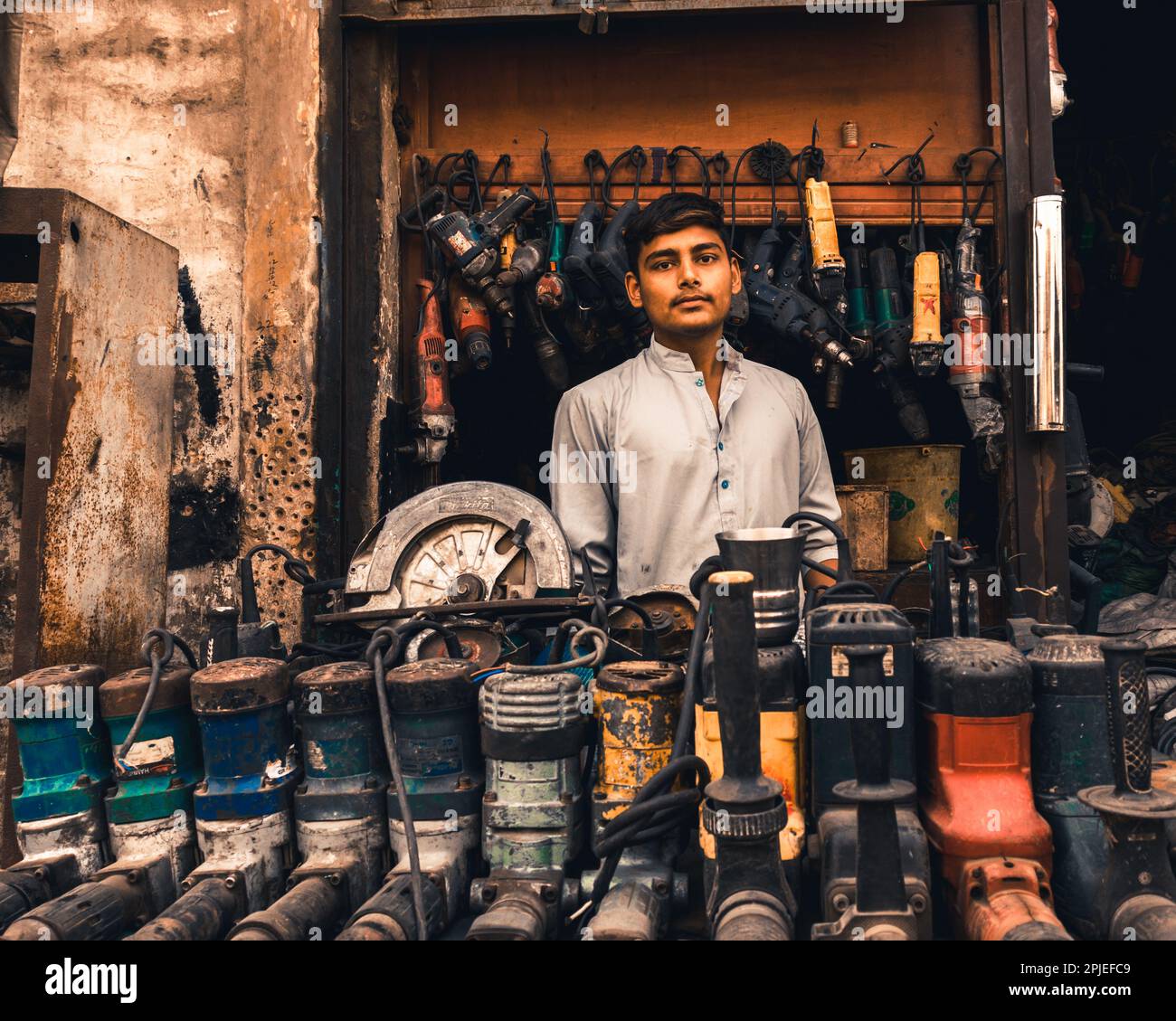 Karachi Pakistan 2019, a boy sitting in a small shop selling and