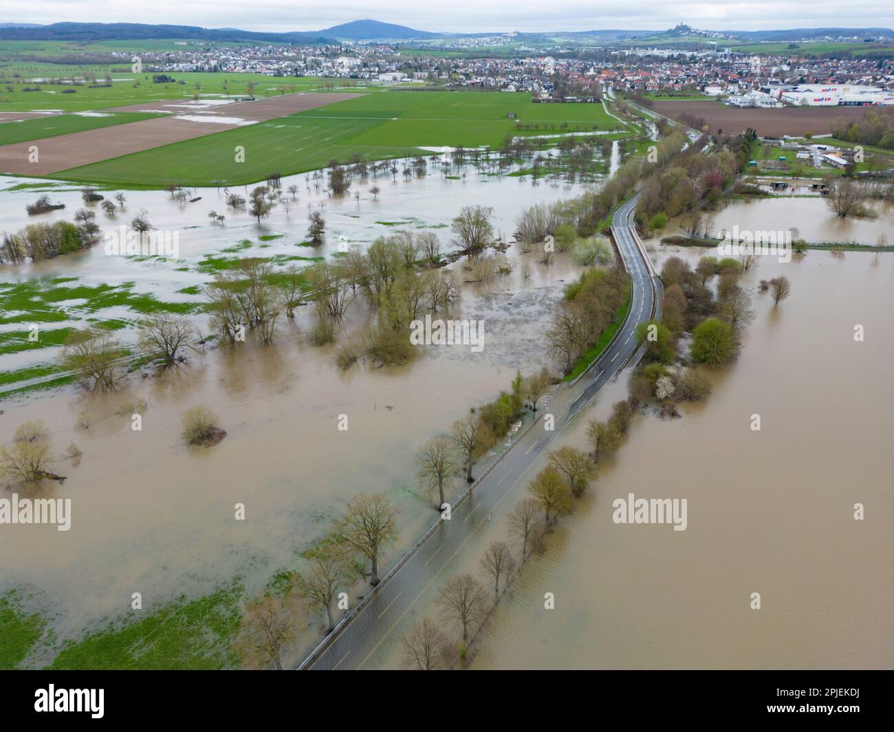 Heuchelheim, Germany. 02nd Apr, 2023. Roads and paths are flooded in Central Hesse (aerial view with a drone). After days of continuous rain, many rivers and streams have burst their banks. Credit: Boris Roessler/dpa/Alamy Live News Stock Photo